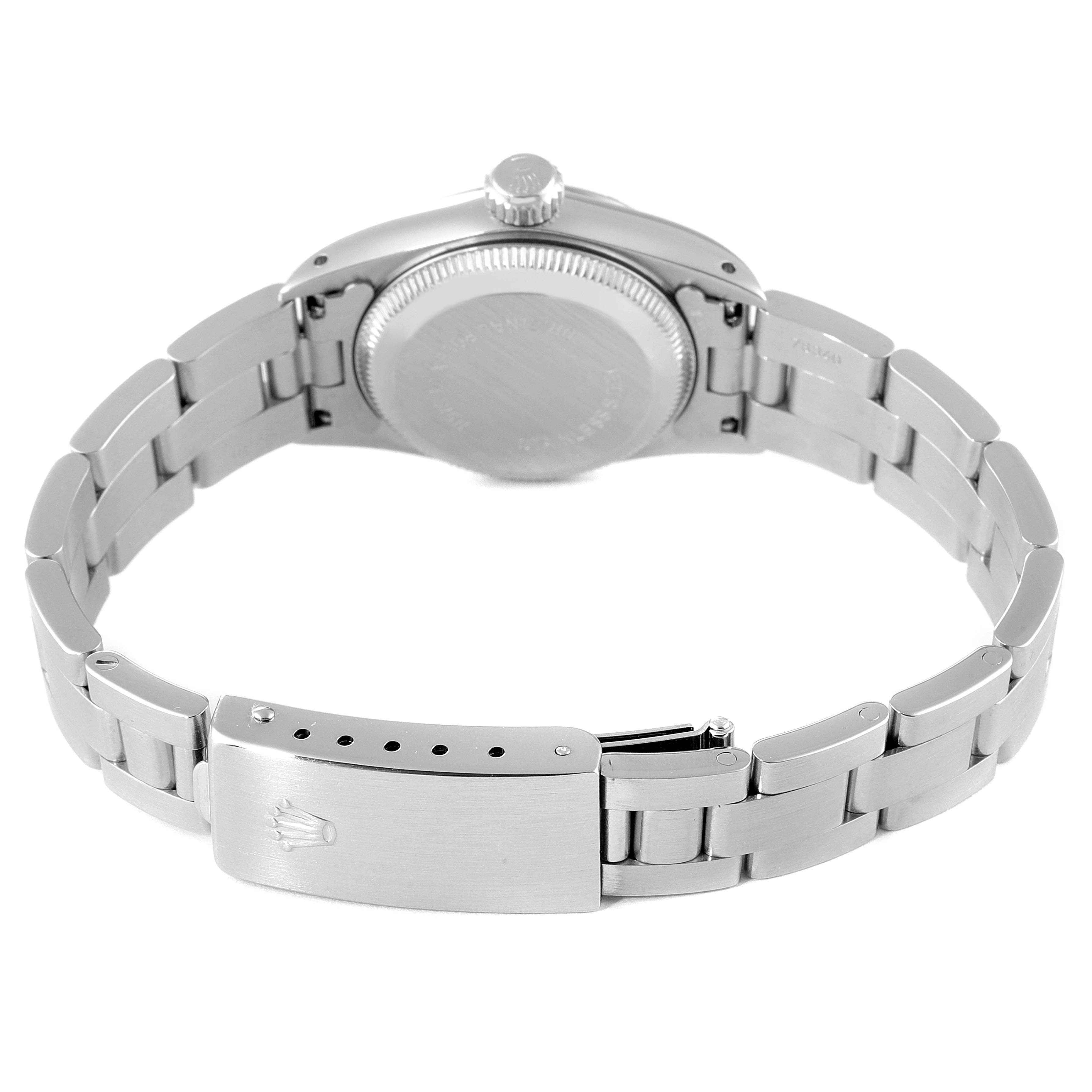 The image shows the back and clasp of the Rolex Oyster Perpetual 67230 Women's Stainless Steel Black Dial 67230 Women's Stainless Steel Black Dial watch, highlighting the bracelet and case back.