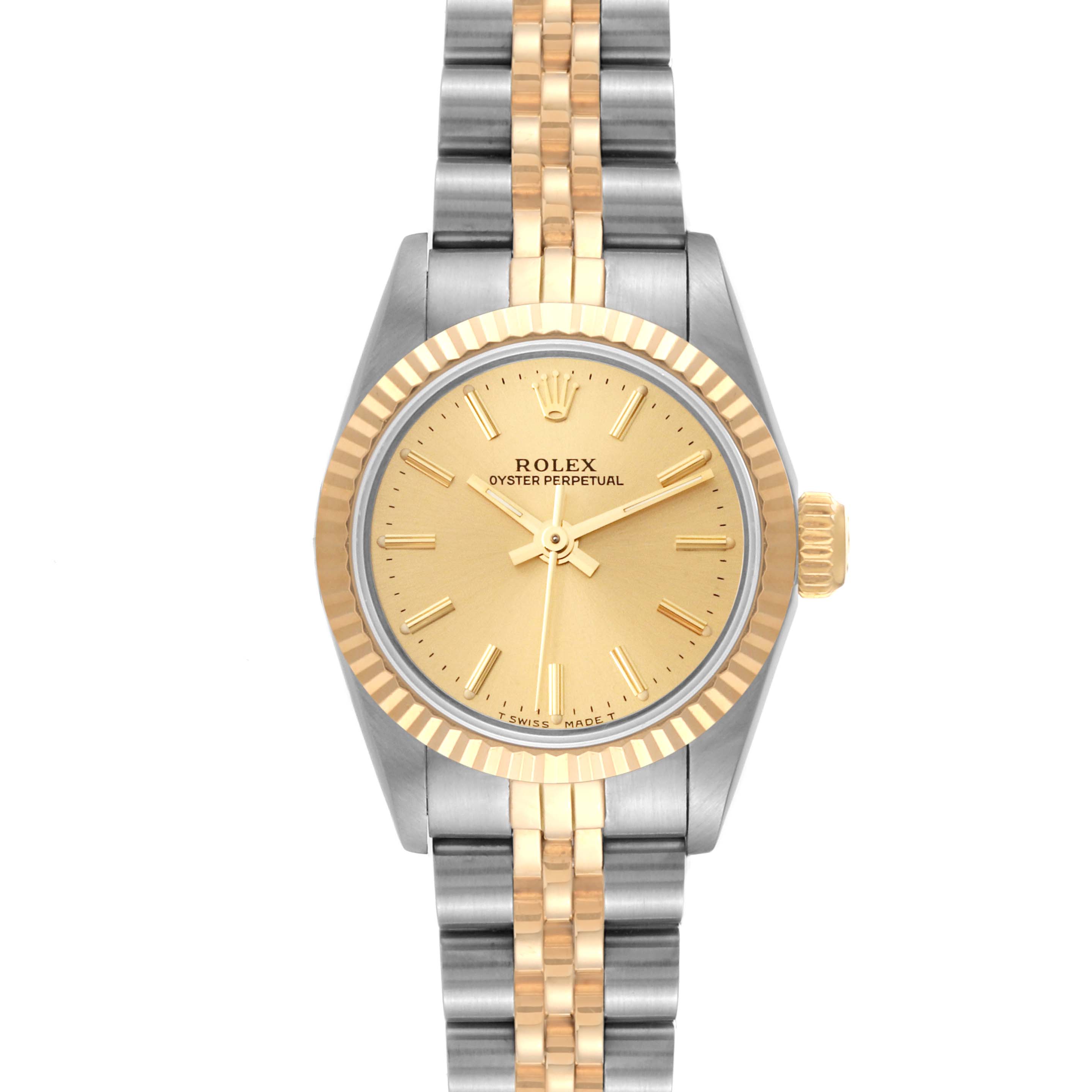 This Rolex Oyster Perpetual 67193 Women's Steel and Gold (two tone) Champagne Dial 67193 Women's Steel and Gold (two tone) Champagne Dial watch is shown from a top-down angle, displaying its face, bezel, crown, and bracelet.