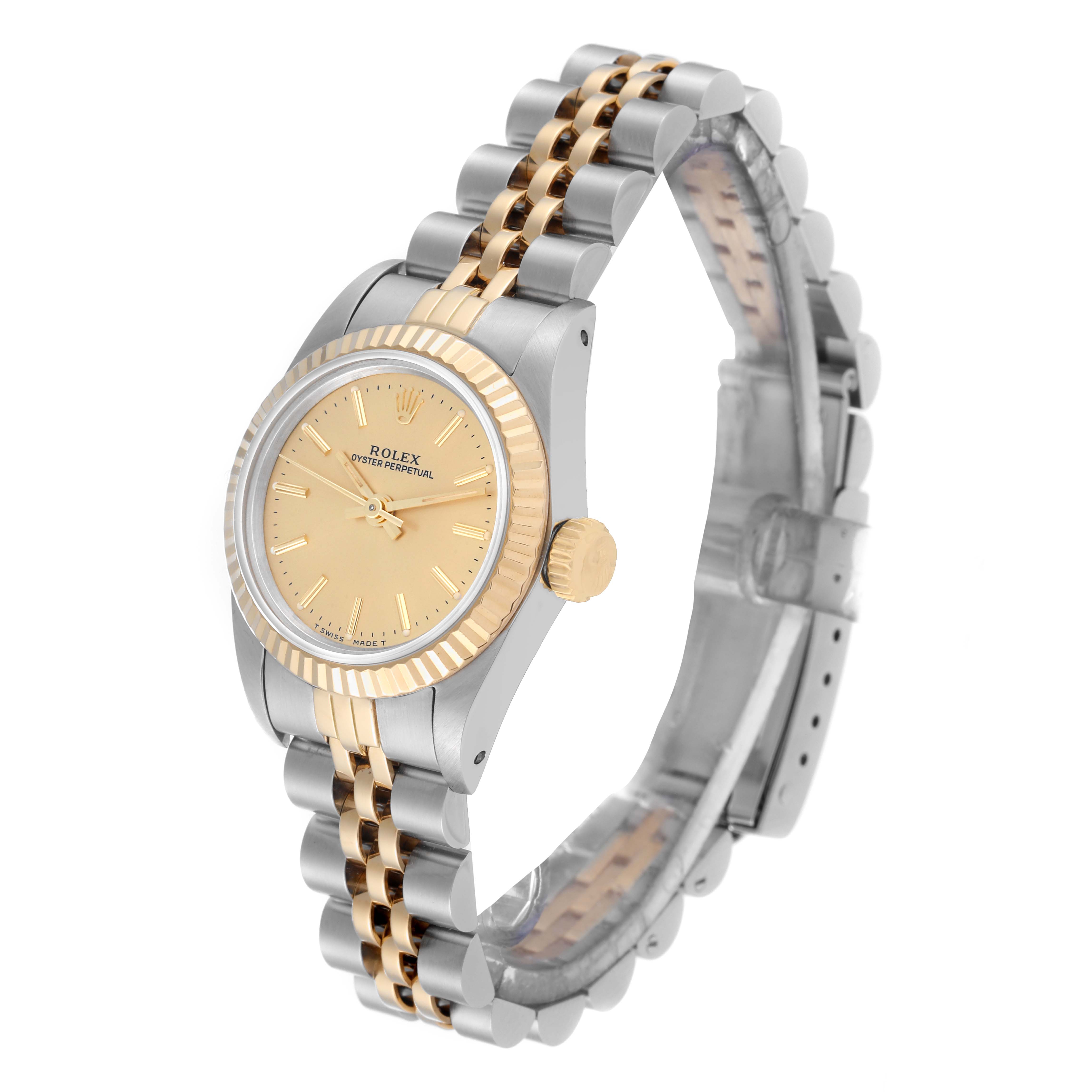 The image shows a side angle of a Rolex Oyster Perpetual 67193 Women's Steel and Gold (two tone) Champagne Dial 67193 Women's Steel and Gold (two tone) Champagne Dial watch, highlighting its two-tone band, crown, and dial.