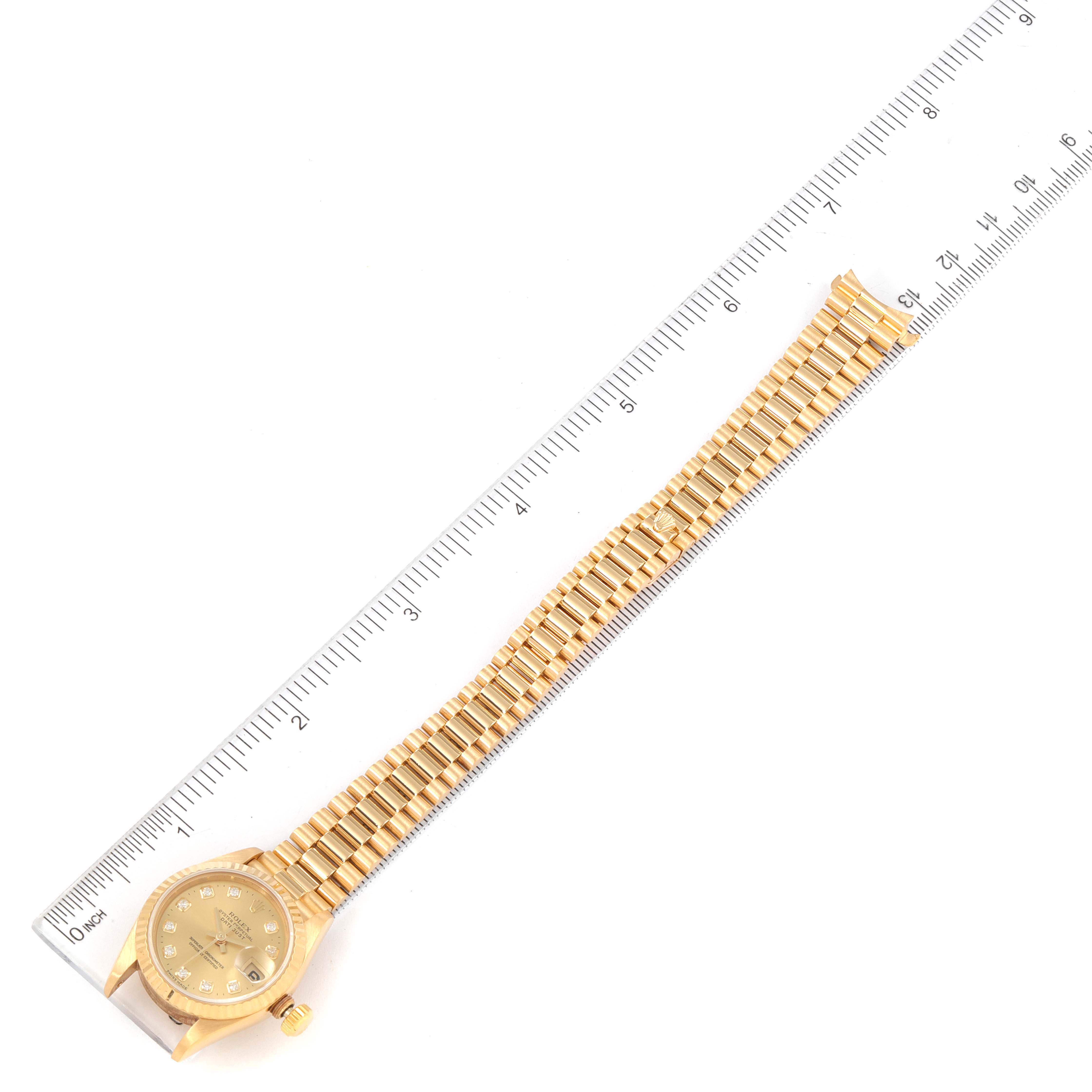 The Rolex President 69178 Women
s Yellow Gold Champagne Dial 69178 Women
s Yellow Gold Champagne Dial model watch is shown flat with its face, bracelet, and a ruler for scale.
