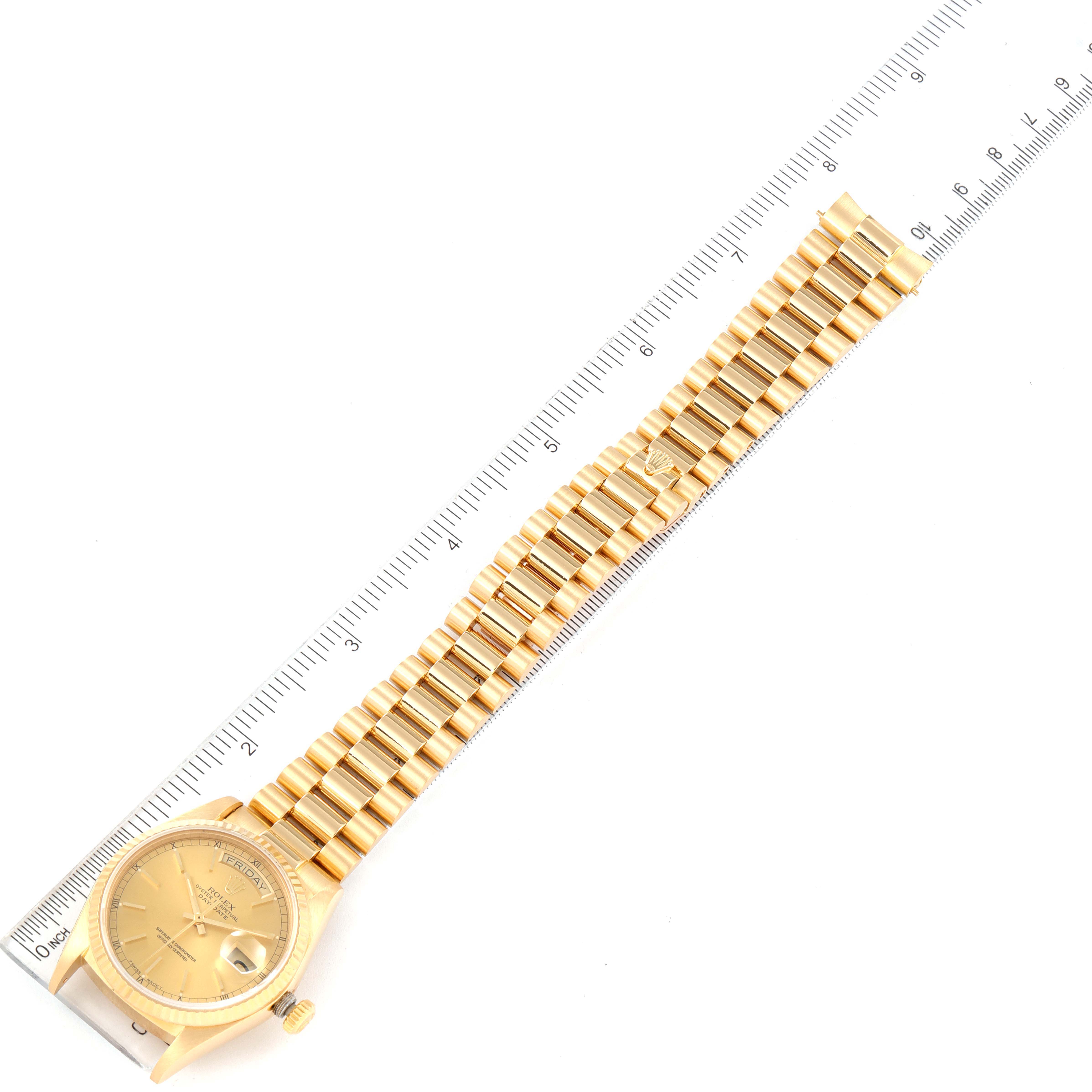 The image shows a top-down view of the Rolex President 18038 Men
s Yellow Gold Champagne Dial 18038 Men
s Yellow Gold Champagne Dial model watch, capturing the face, bezel, and the entire bracelet next to a ruler.