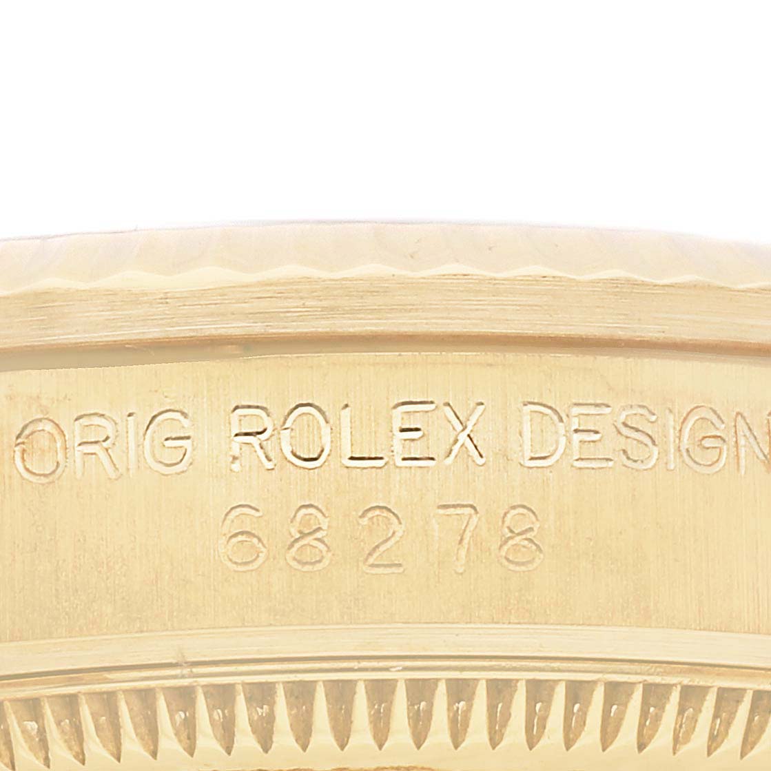 The image shows a close-up of the engraved side of a Rolex President 68278G Women's Yellow Gold Black Dial 68278G Women's Yellow Gold Black Dial model, displaying "ORIG ROLEX DESIGN 68278".