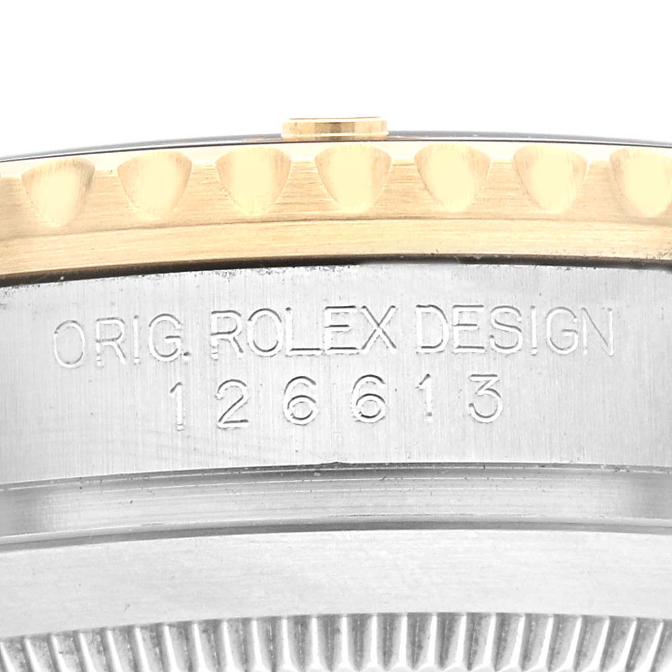 The image shows a close-up of the side engraving and bezel of a Rolex Submariner 126613LN Men's Steel and Gold (two tone) Black Dial 126613LN Men's Steel and Gold (two tone) Black Dial model.