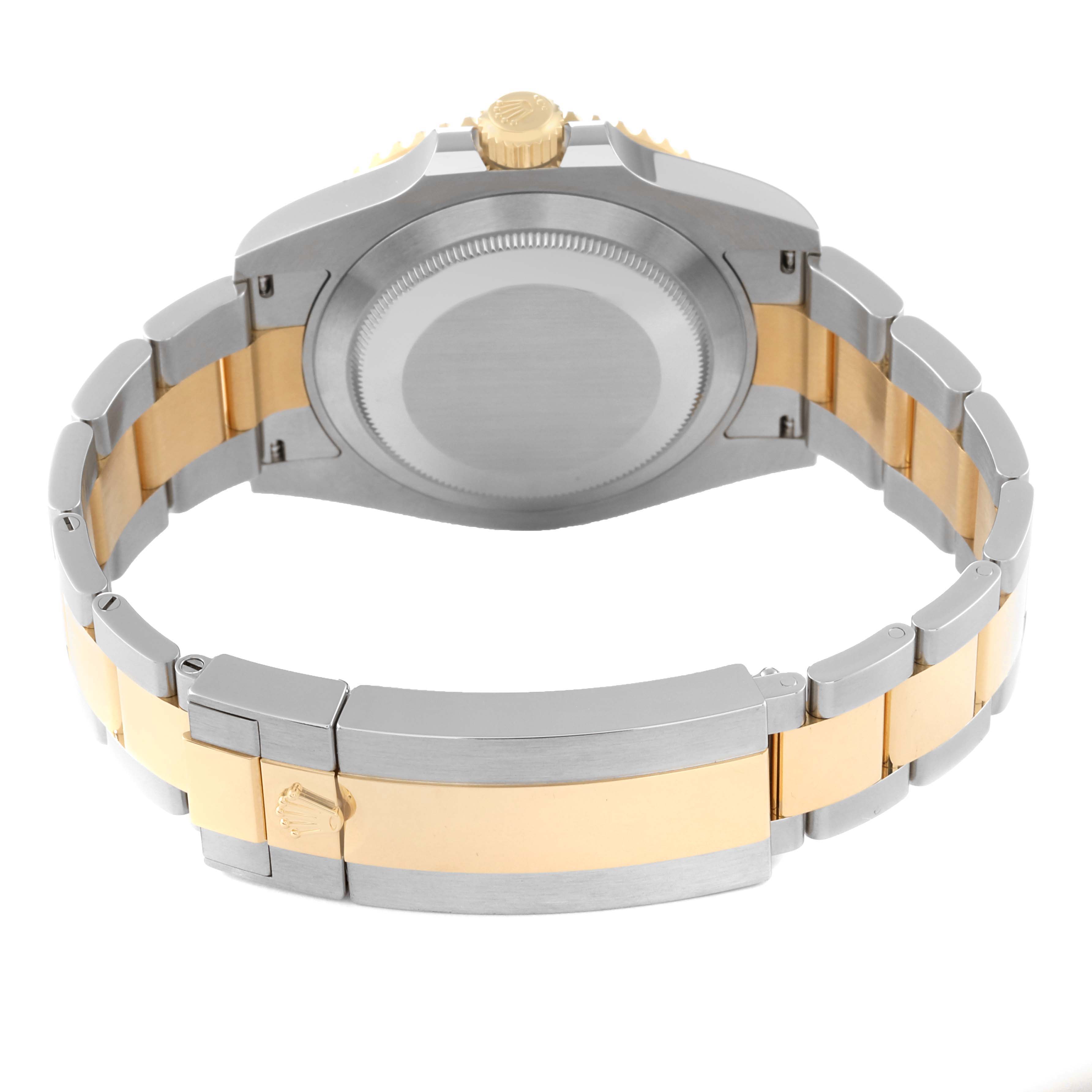 This image shows the back view of a Rolex Submariner 126613LB Men
s Steel and Gold (two tone) Blue Dial 126613LB Men
s Steel and Gold (two tone) Blue Dial watch, highlighting its case back, crown, and two-tone bracelet.