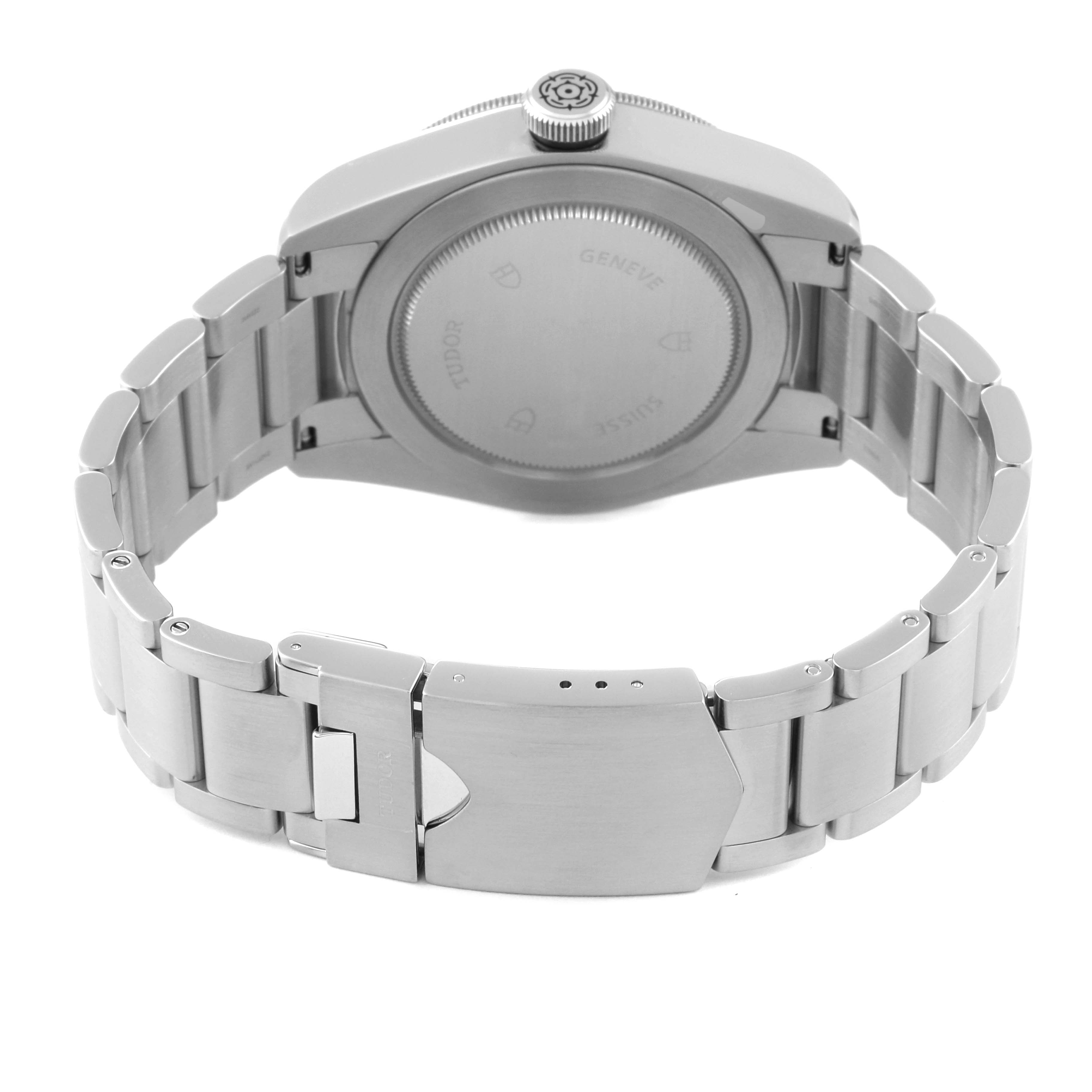 The image shows the back view of a Tudor Heritage Black Bay 79220B Men
s Stainless Steel Black Dial 79220B Men
s Stainless Steel Black Dial watch, focusing on the case back and bracelet.