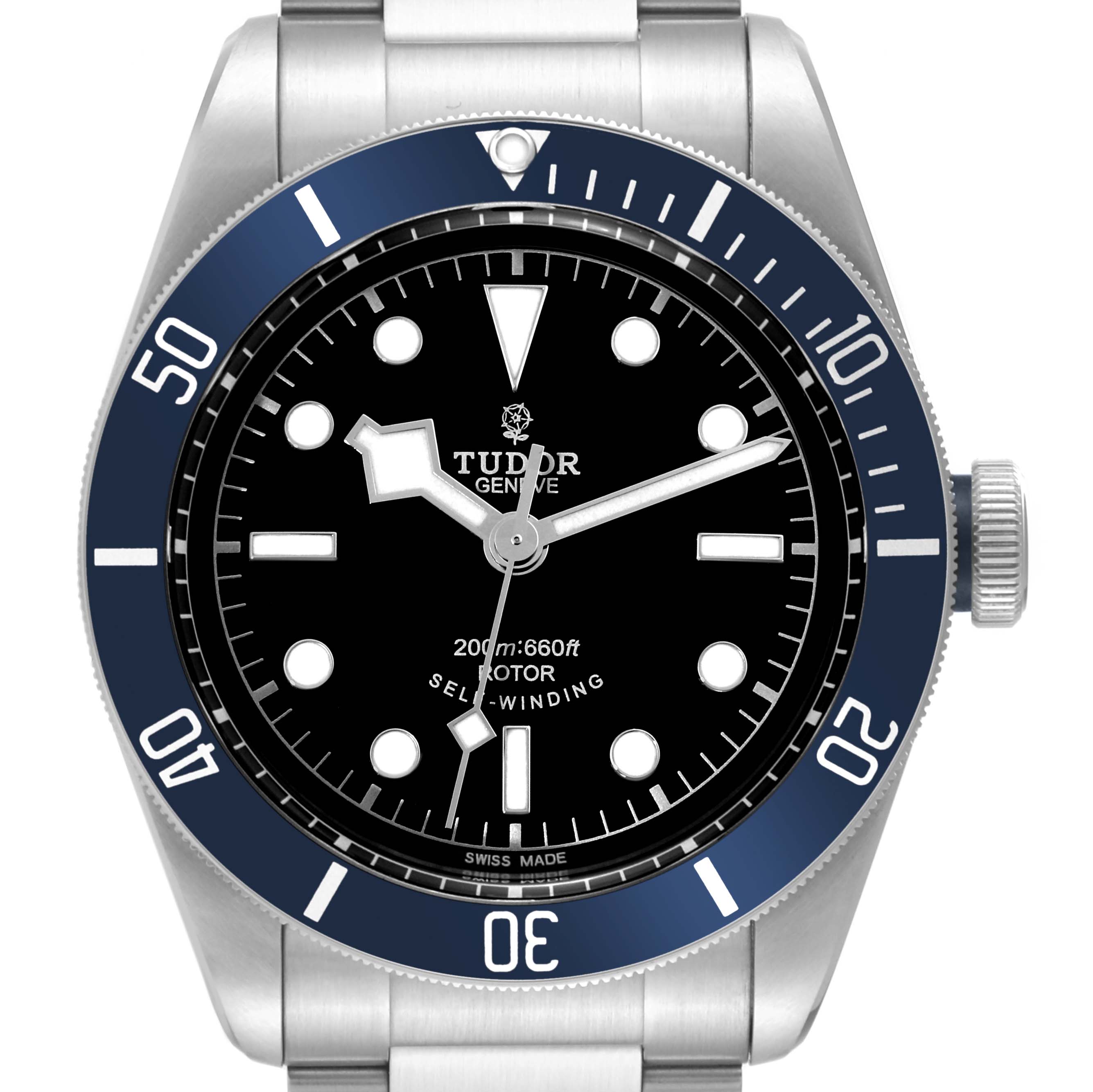 The image shows a front view of the Tudor Heritage Black Bay 79220B Men
s Stainless Steel Black Dial 79220B Men
s Stainless Steel Black Dial watch, featuring its dial, bezel, and parts of its stainless steel bracelet.