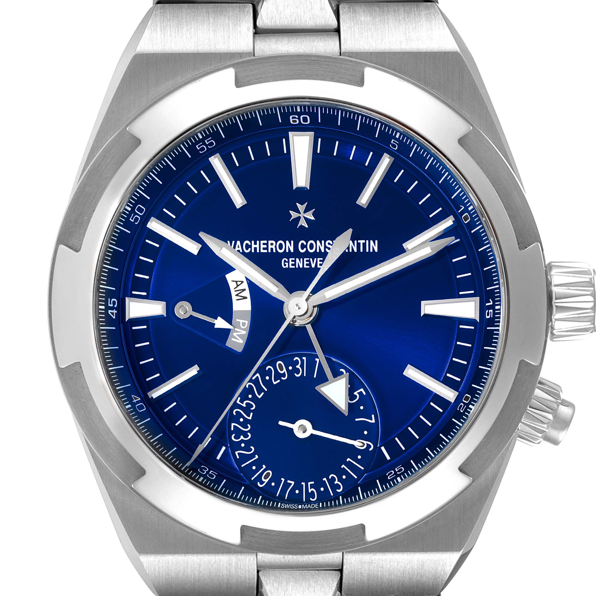 The image shows the face of the Vacheron Constantin Overseas 7900V/110A-B334 Men's Stainless Steel Blue Dial 7900V/110A-B334 Men's Stainless Steel Blue Dial model, highlighting the blue dial, hour markers, and crown.
