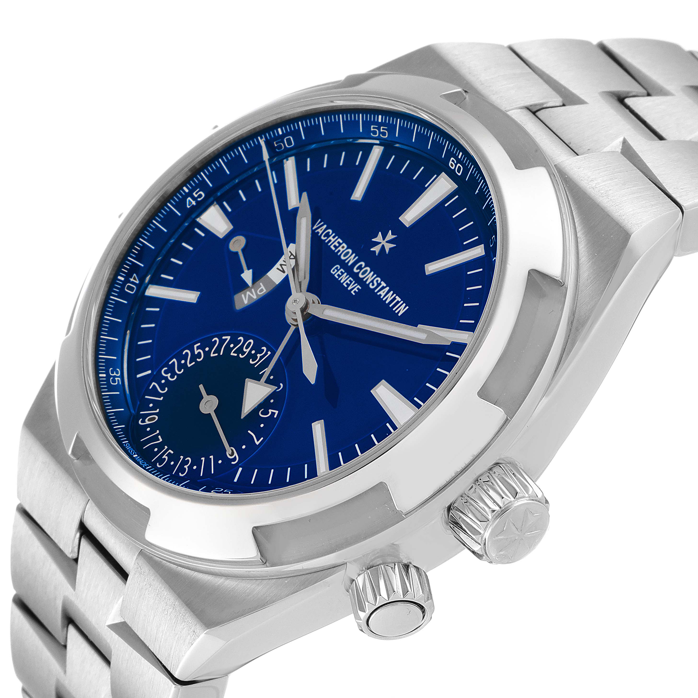 The image shows a Vacheron Constantin Overseas 7900V/110A-B334 Men's Stainless Steel Blue Dial 7900V/110A-B334 Men's Stainless Steel Blue Dial watch at an angle displaying the face, crown, and part of the bracelet.