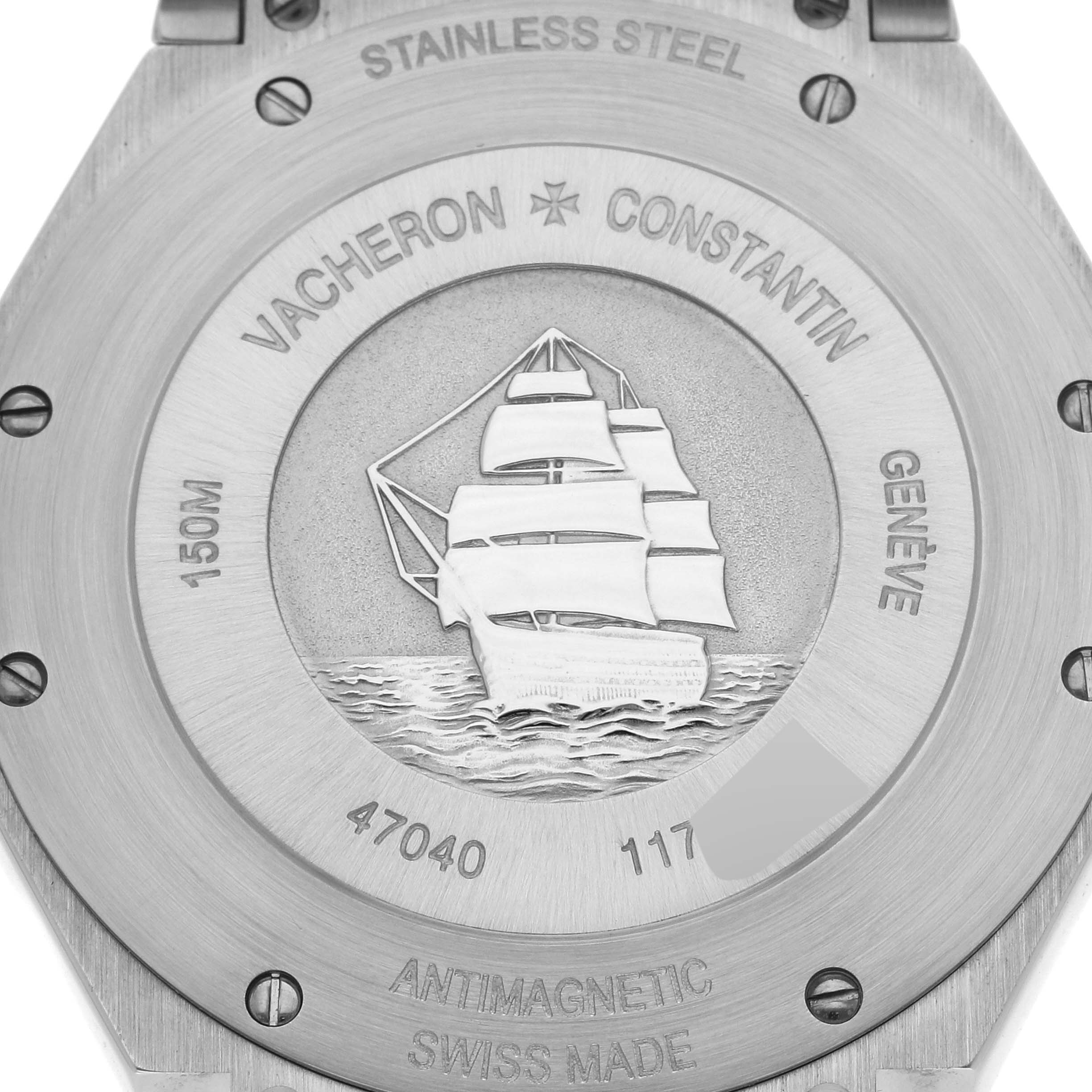 The image shows the back case of the Vacheron Constantin Overseas 47040 Men's Stainless Steel Silver Dial 47040 Men's Stainless Steel Silver Dial watch, featuring engravings and a ship design.