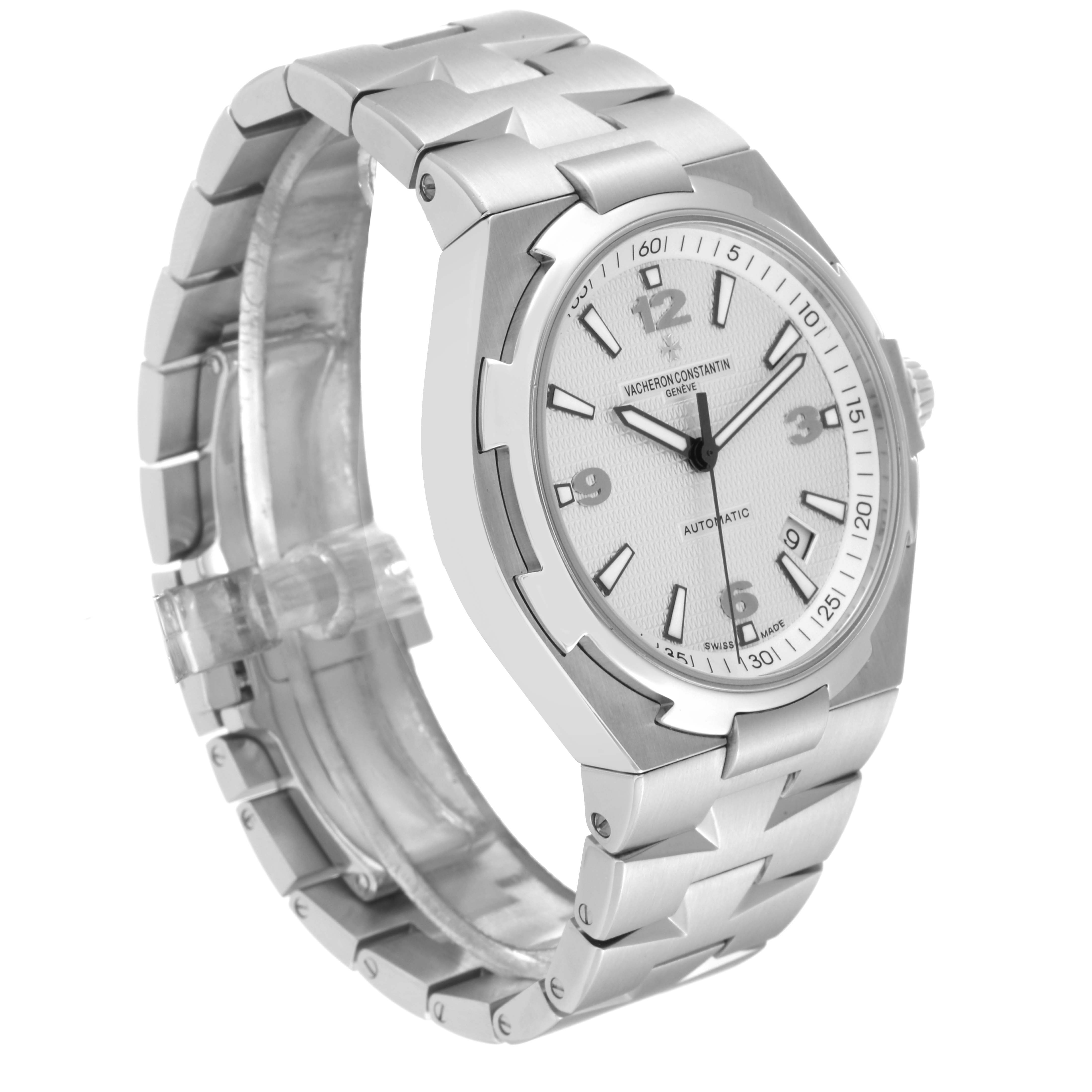 The image shows a Vacheron Constantin Overseas 47040 Men's Stainless Steel Silver Dial 47040 Men's Stainless Steel Silver Dial model watch at a three-quarter angle, highlighting the face, bezel, and bracelet.