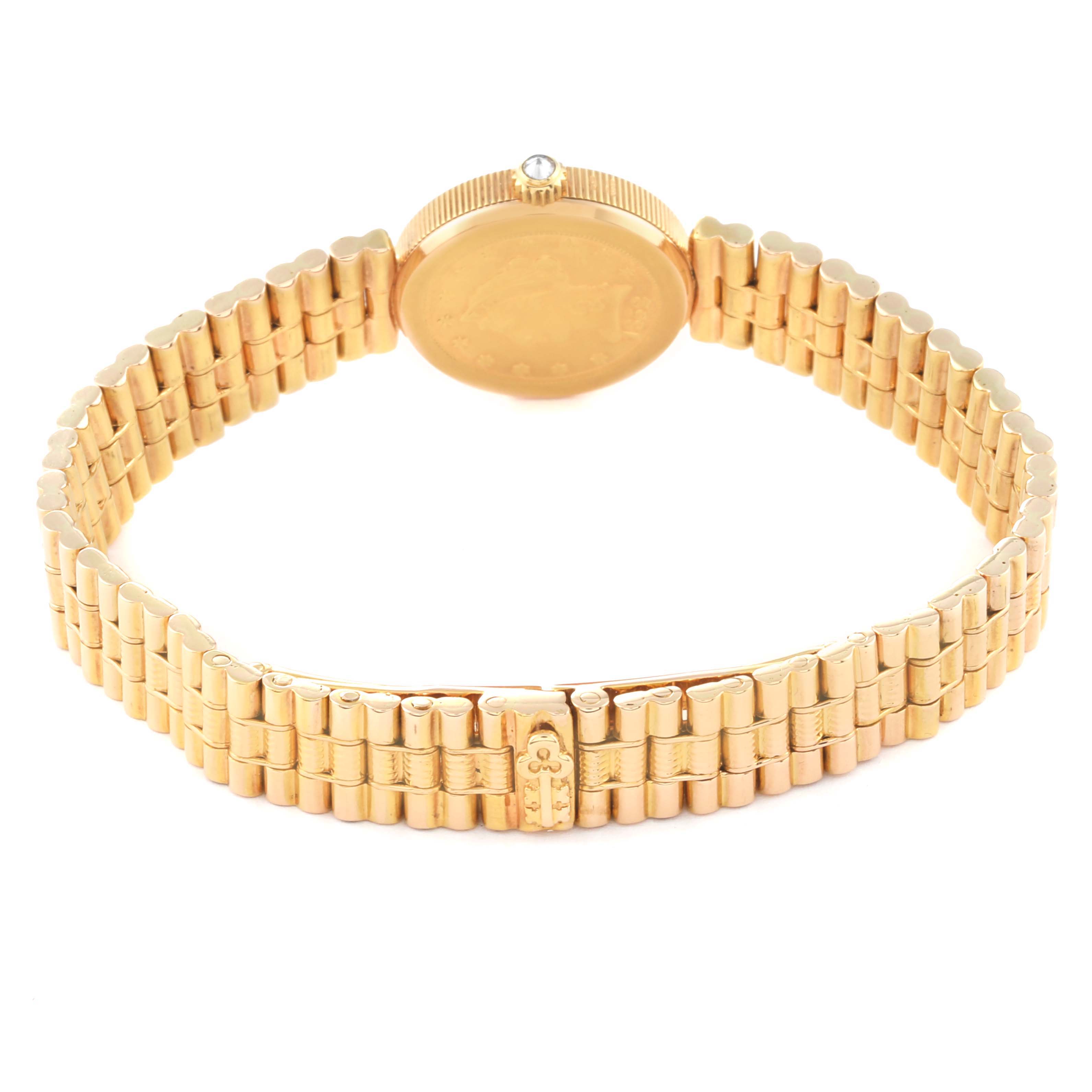 This image shows the back and band of a Corum 1852 Women
s Yellow Gold Champagne Dial 1852 Women
s Yellow Gold Champagne Dial 2.5 Dollars Eagle Liberty Coin Yellow Gold Ladies Watch 1852 model from a rear angle.