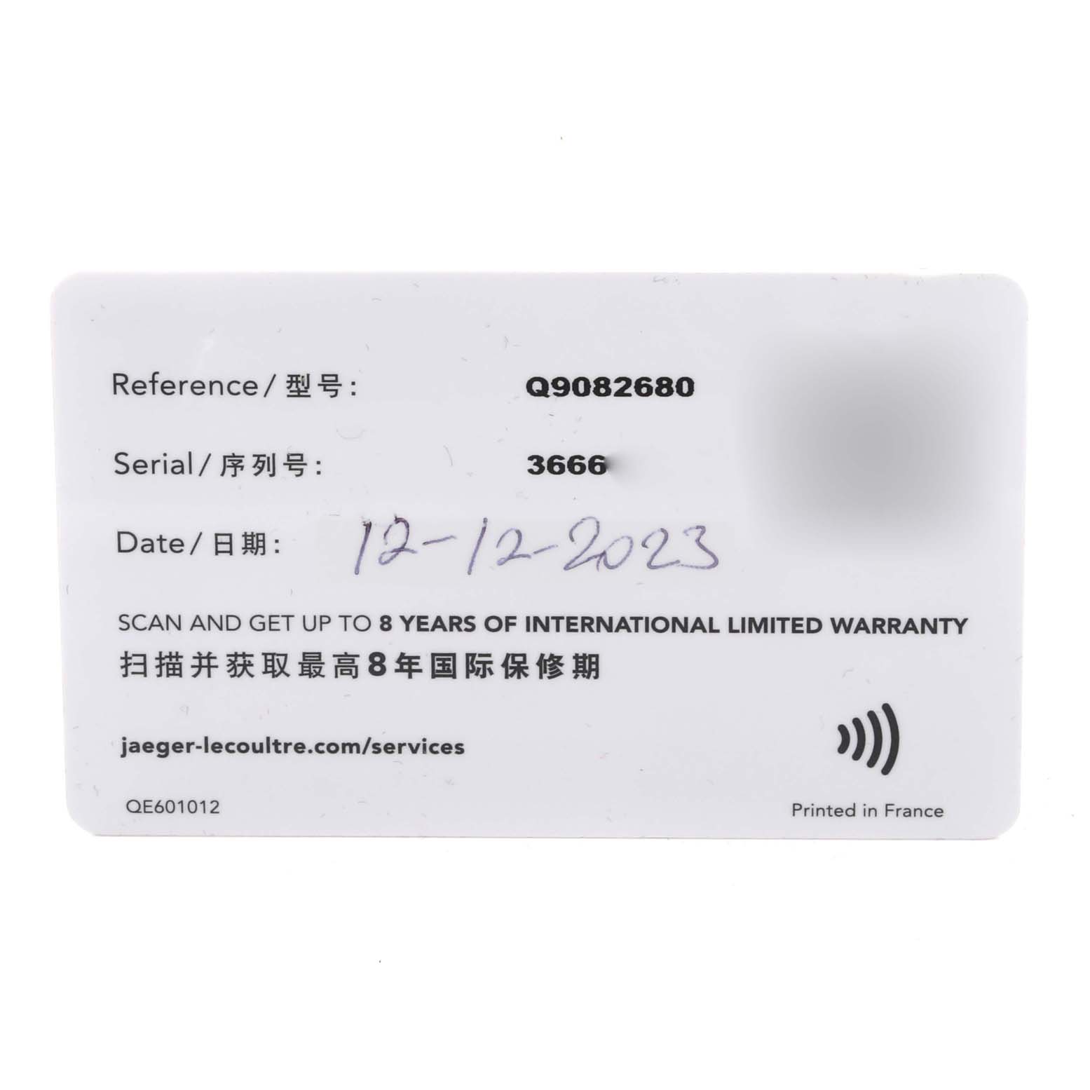 The image shows the warranty card of a Jaeger-LeCoultre Polaris watch, with reference, serial numbers, and a hand-written date.