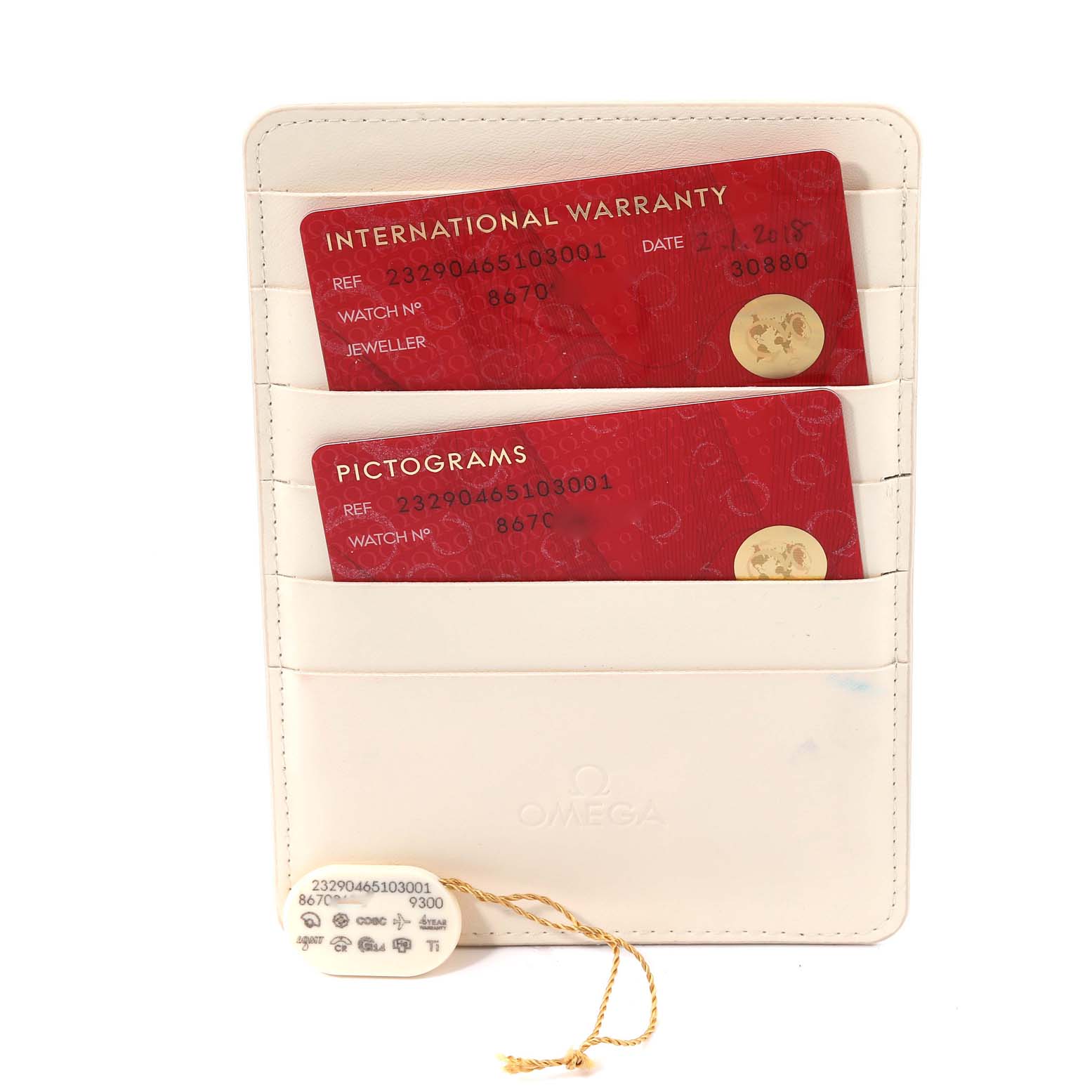 The image shows International Warranty and Pictograms cards for the Omega Planet Ocean 232.90.46.51.03.001 Men
s Titanium Blue Dial 232.90.46.51.03.001 Men
s Titanium Blue Dial watch, along with a tag, inside a cardholder.