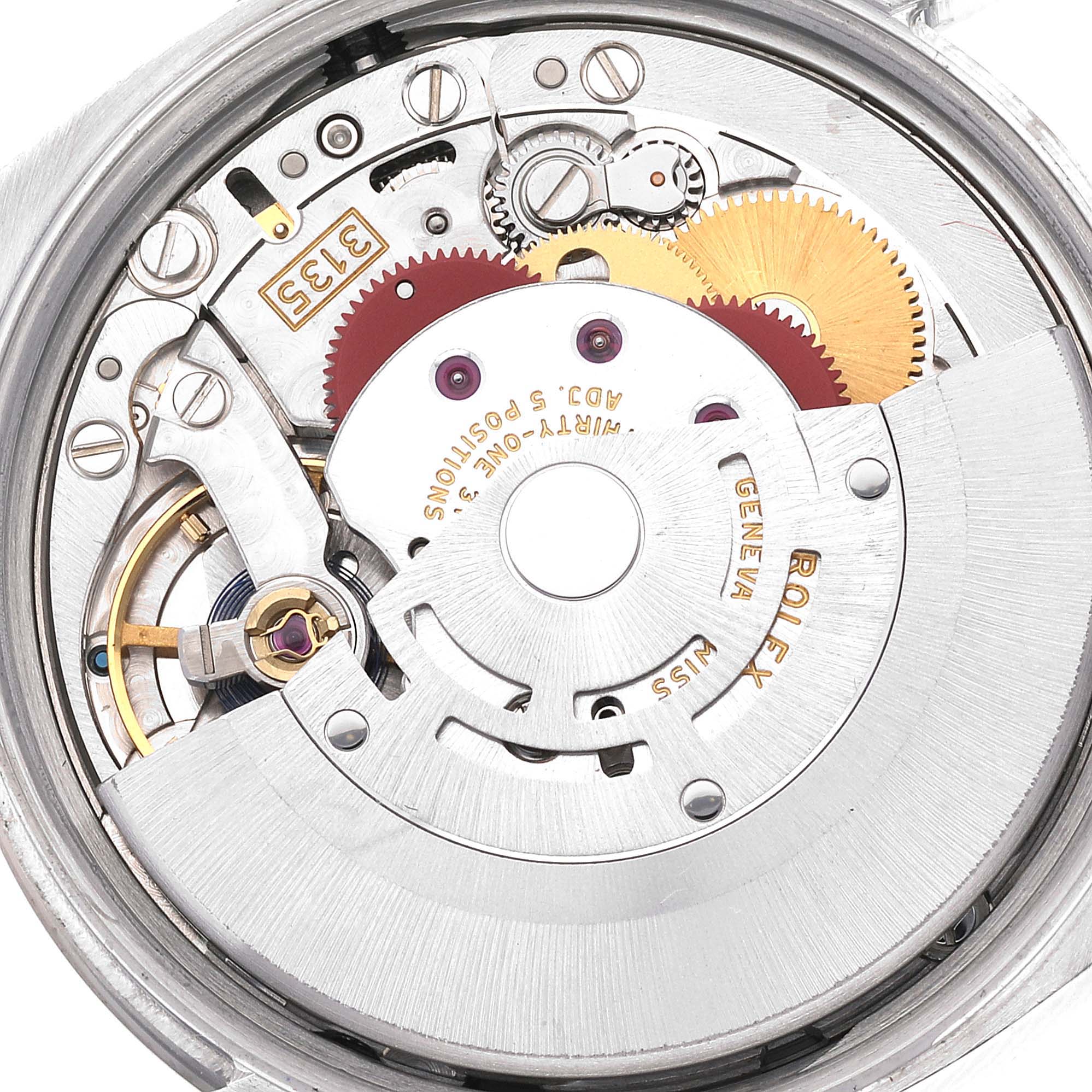 This is an image of the internal mechanism of a Rolex Date 115234 Men's Stainless Steel Black Dial 115234 Men's Stainless Steel Black Dial model watch, showing gears and intricate components.
