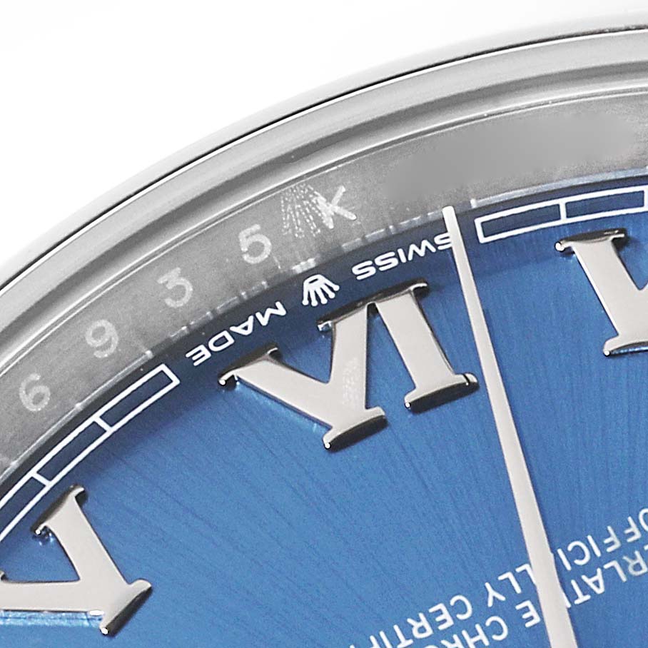 This close-up image shows the dial and rehaut of the Rolex Datejust 41 126300 Men
s Stainless Steel Blue Dial 126300 Men
s Stainless Steel Blue Dial, emphasizing the Roman numeral VI and "Swiss Made" text.