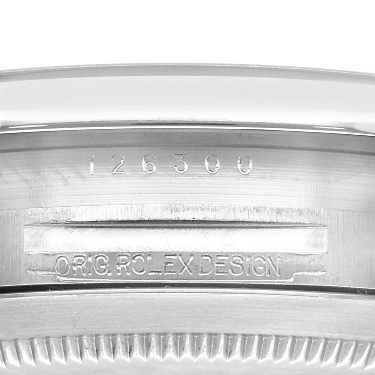 This close-up image of the Rolex Datejust 41 126300 Men
s Stainless Steel Blue Dial 126300 Men
s Stainless Steel Blue Dial model shows the case side, including the model number and "ORIG ROLEX DESIGN" engravings.