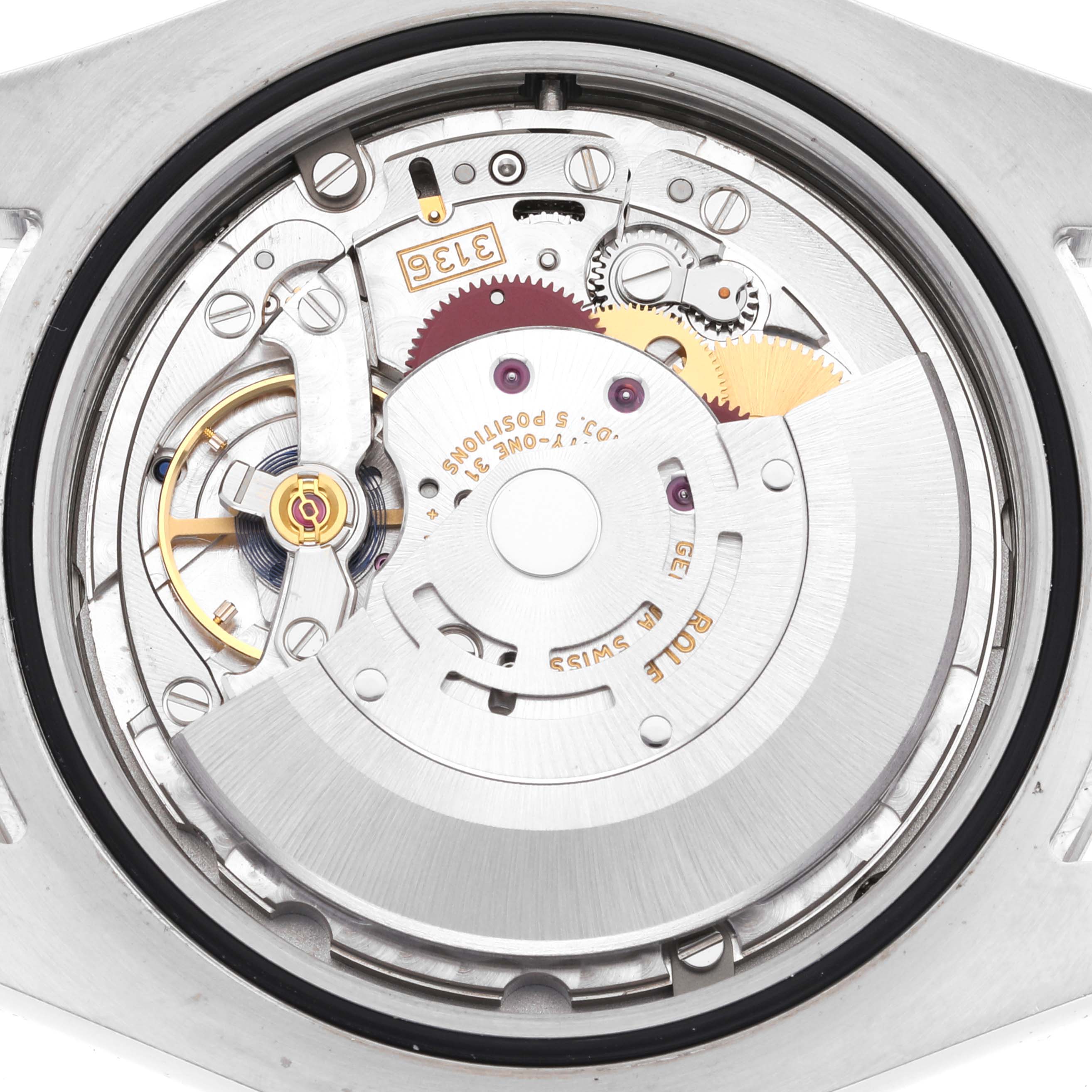 This is a close-up view of the movement mechanism inside a Rolex Datejust 116334 Men
s Stainless Steel Silver Dial 116334 Men
s Stainless Steel Silver Dial watch.