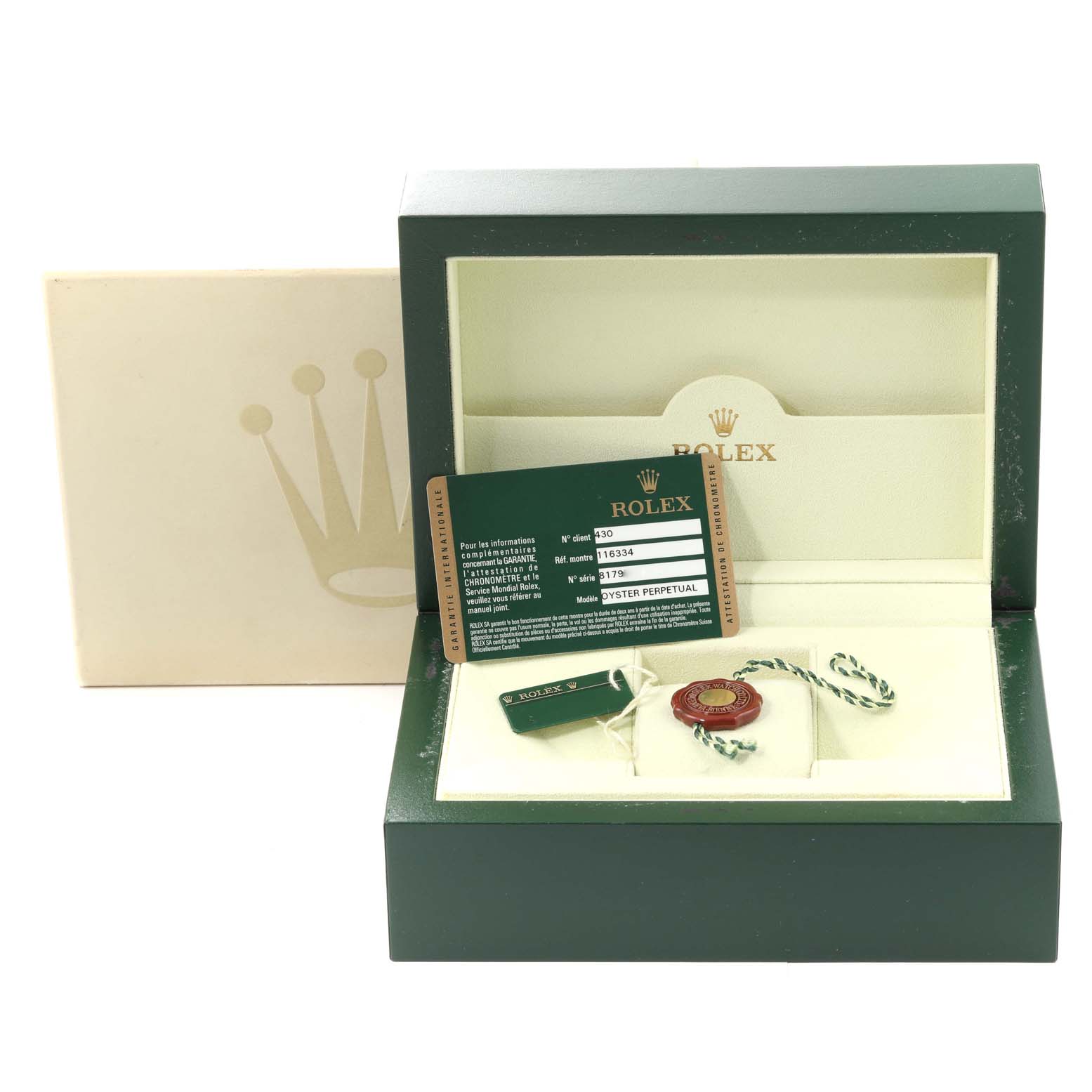 The image shows the open box for a Rolex Datejust 116334 Men
s Stainless Steel Silver Dial 116334 Men
s Stainless Steel Silver Dial watch, displaying accompanying accessories including tags and a certificate.