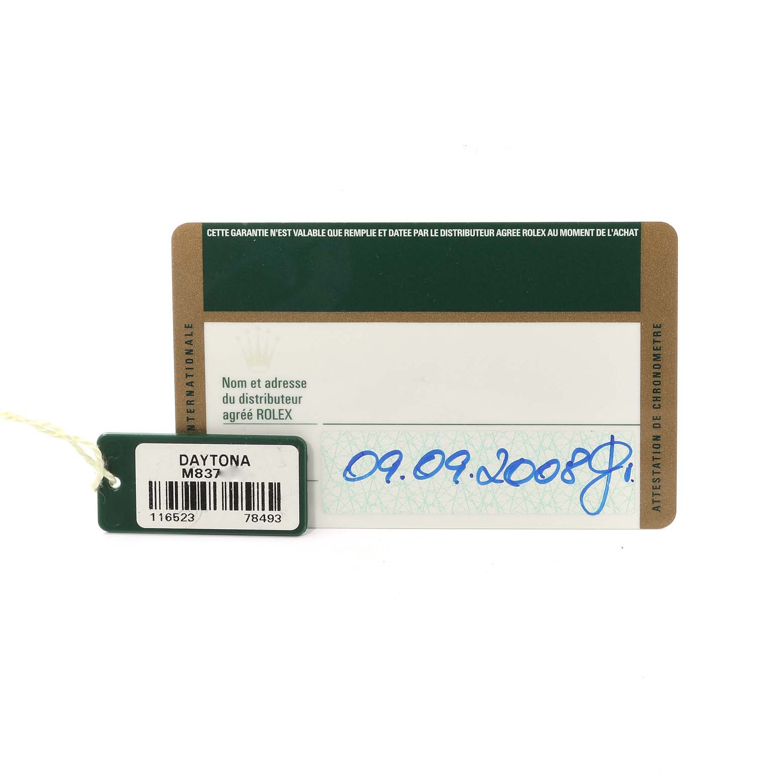The image shows a warranty card and a tag for a Rolex Daytona 116523 Men
s Steel and Gold (two tone) Black Dial 116523 Men
s Steel and Gold (two tone) Black Dial watch, with the tag displaying the model number "M837."