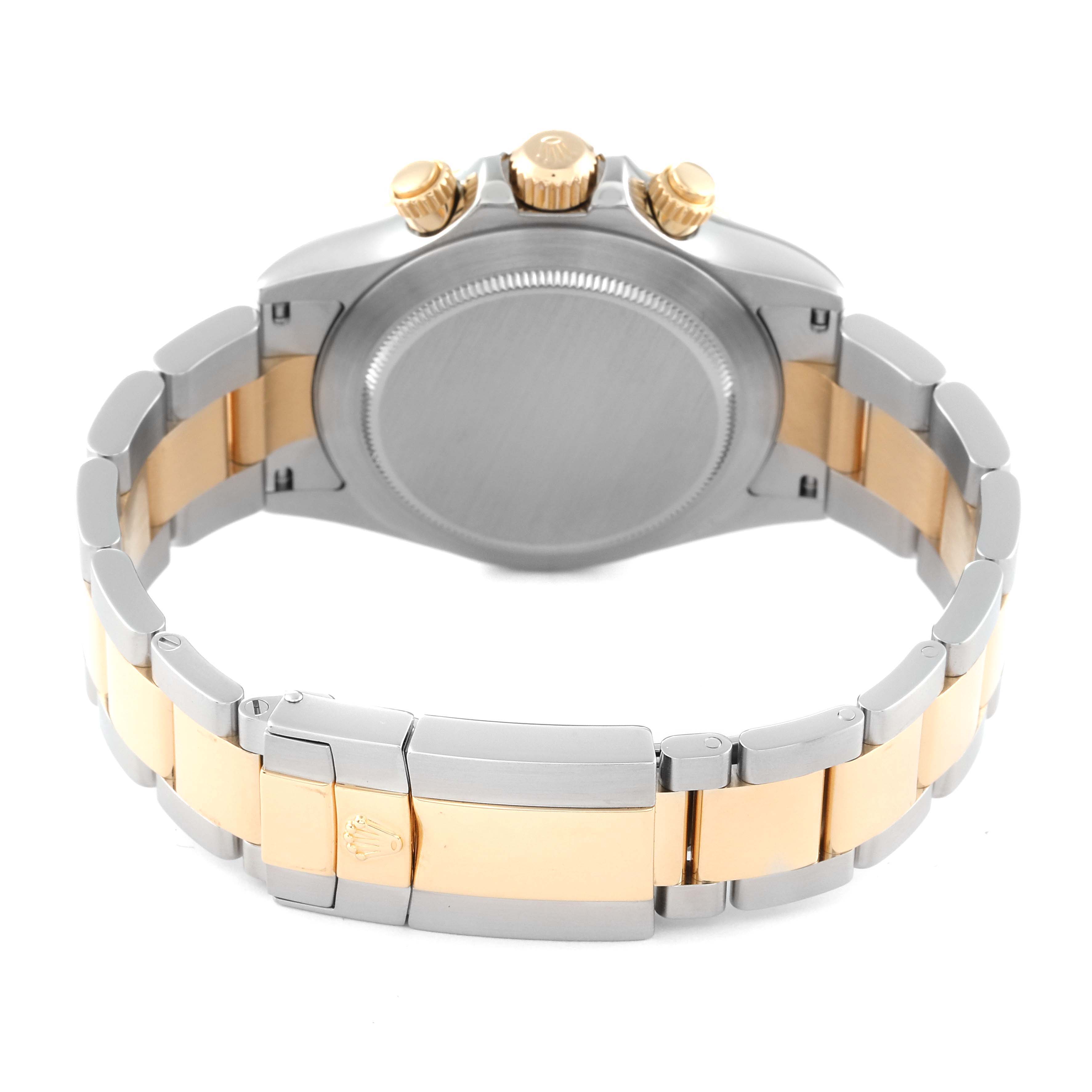 This image shows the backside and bracelet of the Rolex Daytona 116523 Men
s Steel and Gold (two tone) Black Dial 116523 Men
s Steel and Gold (two tone) Black Dial watch, highlighting its two-tone metal.