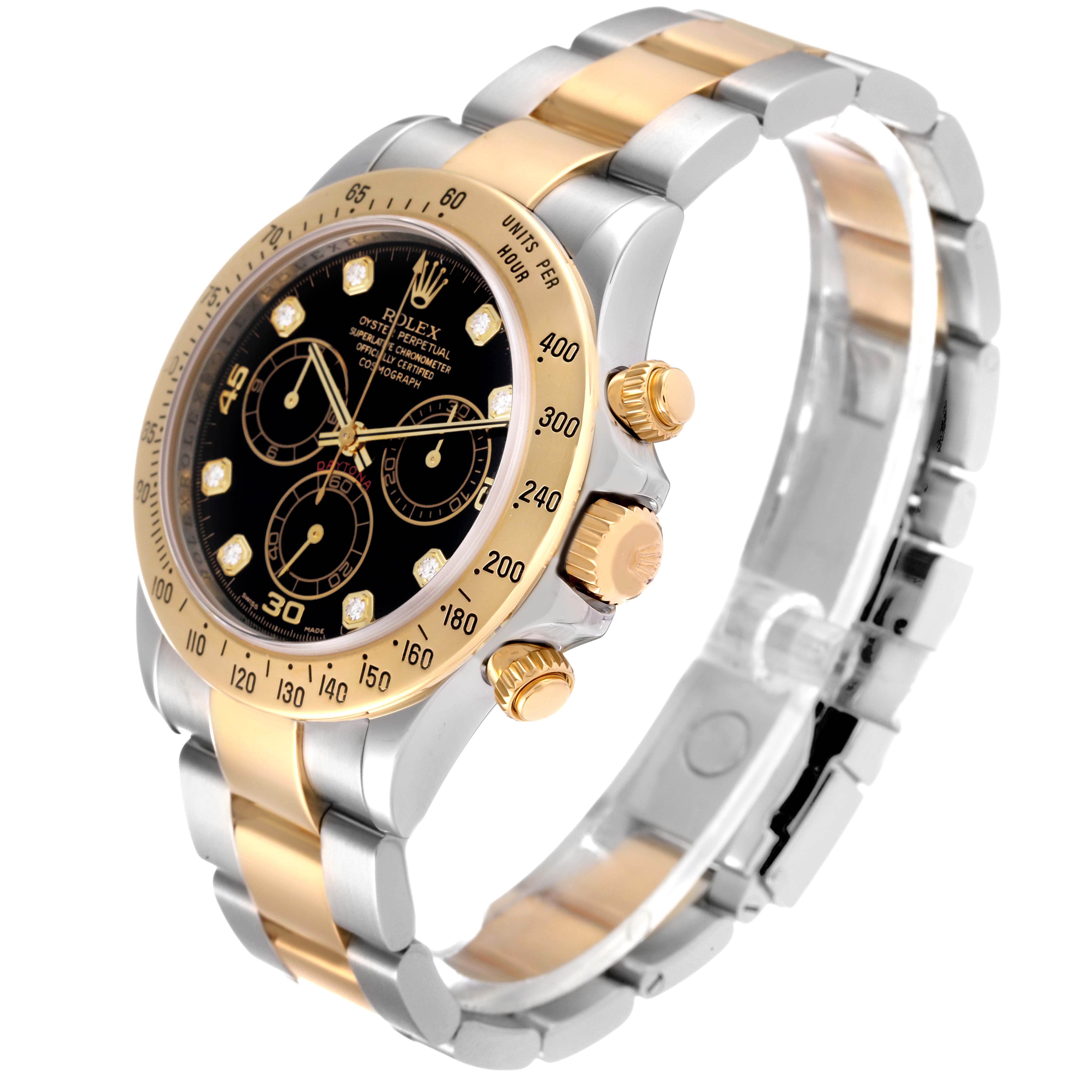 The Rolex Daytona 116523 Men
s Steel and Gold (two tone) Black Dial 116523 Men
s Steel and Gold (two tone) Black Dial watch is displayed at an angle, showing its black dial, gold bezel, and two-tone bracelet with side buttons.