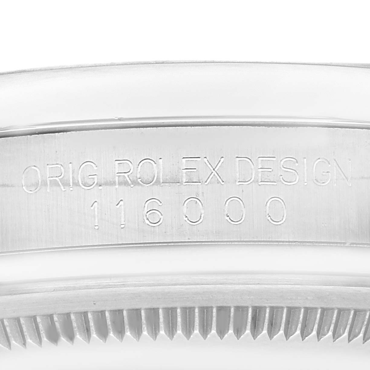 This is a close-up of the case side of the Rolex Oyster Perpetual 116000 Men
s Stainless Steel Blue Dial 116000 Men
s Stainless Steel Blue Dial model, showing the engraved model number "116000".