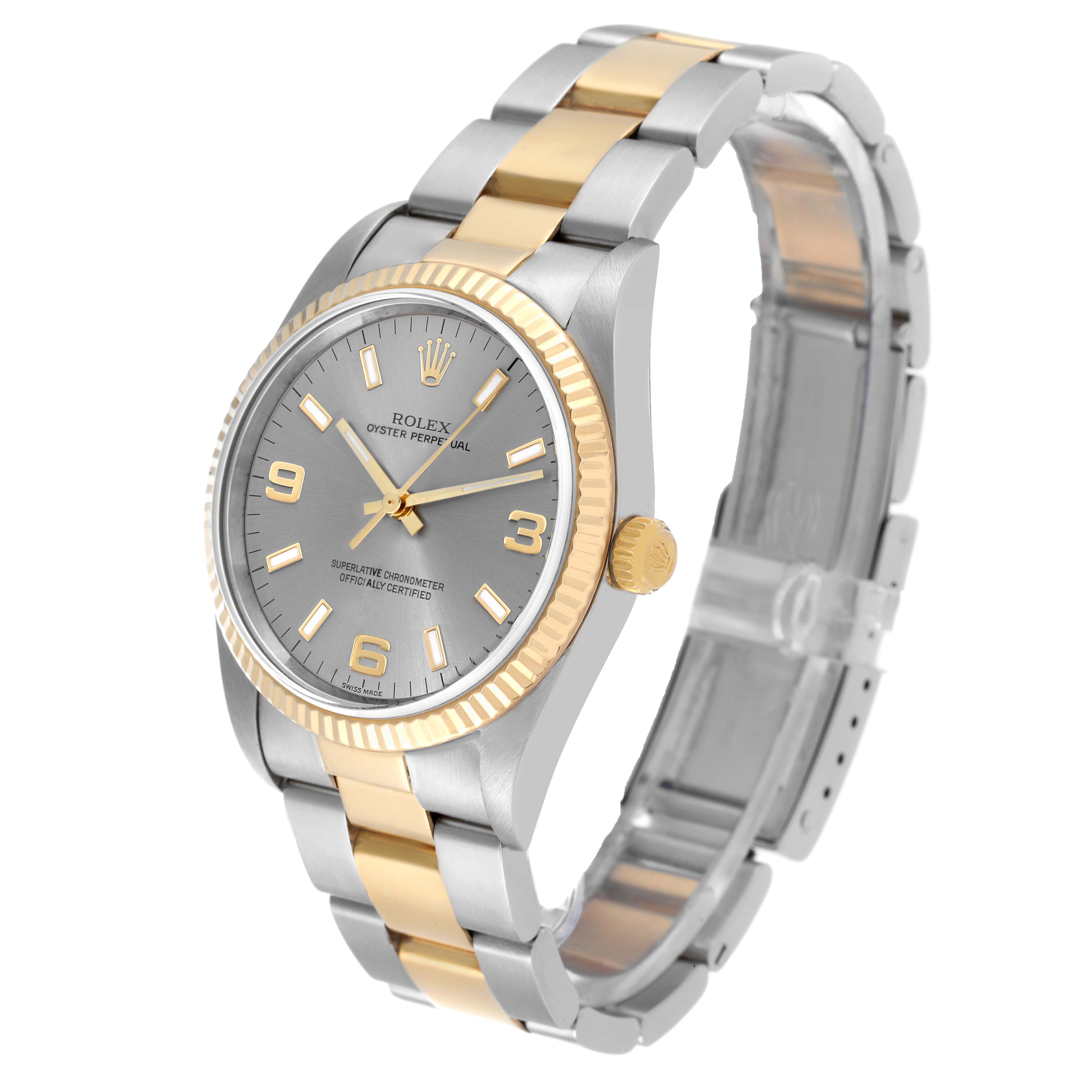 The image shows a Rolex Oyster Perpetual 14233 Men's Steel and Gold (two tone) Grey Dial 14233 Men's Steel and Gold (two tone) Grey Dial watch at a slight angle displaying its face, crown, bezel, and two-tone bracelet.