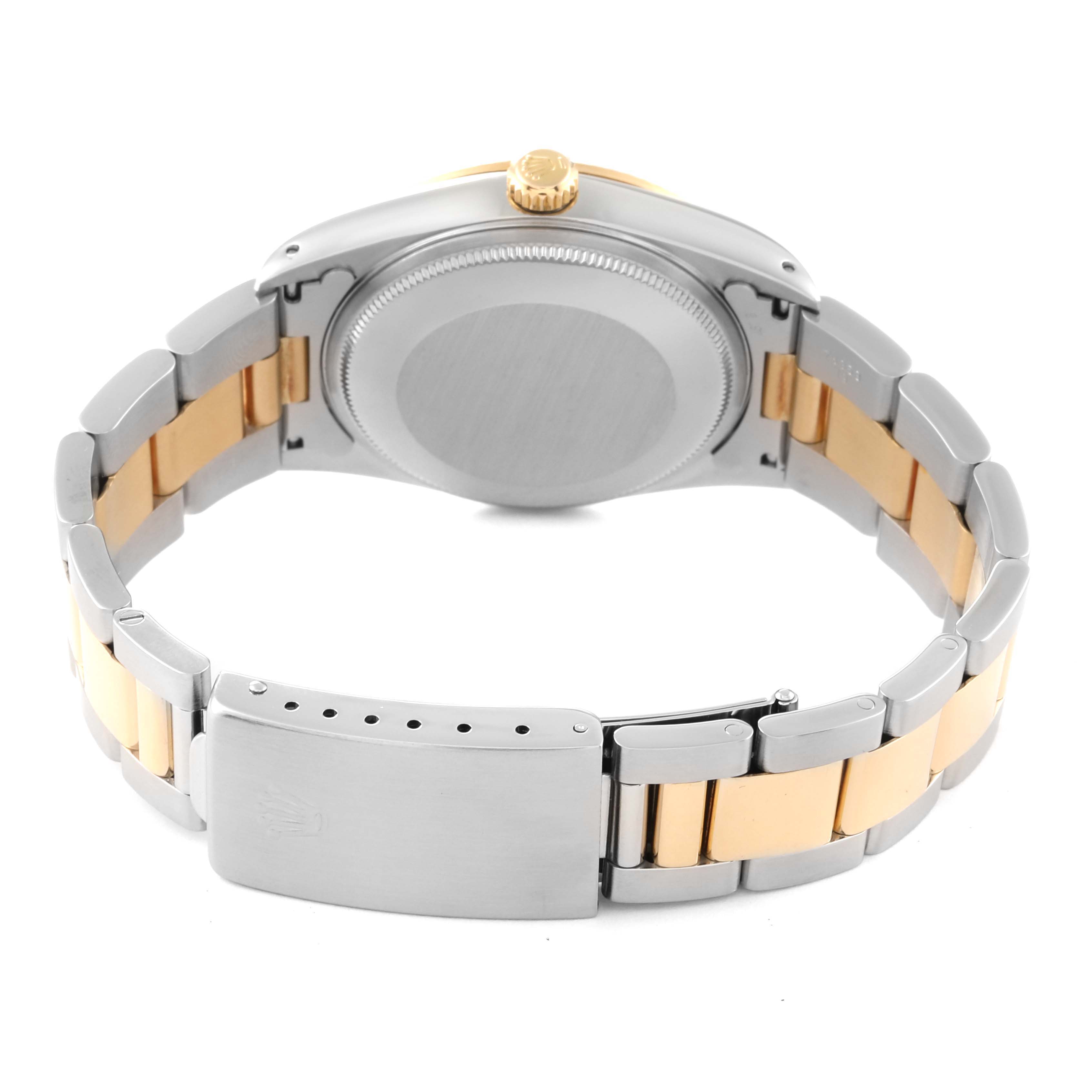 The image shows the backside of a Rolex Oyster Perpetual 14233 Men's Steel and Gold (two tone) Grey Dial 14233 Men's Steel and Gold (two tone) Grey Dial watch, displaying its case back and two-tone bracelet.
