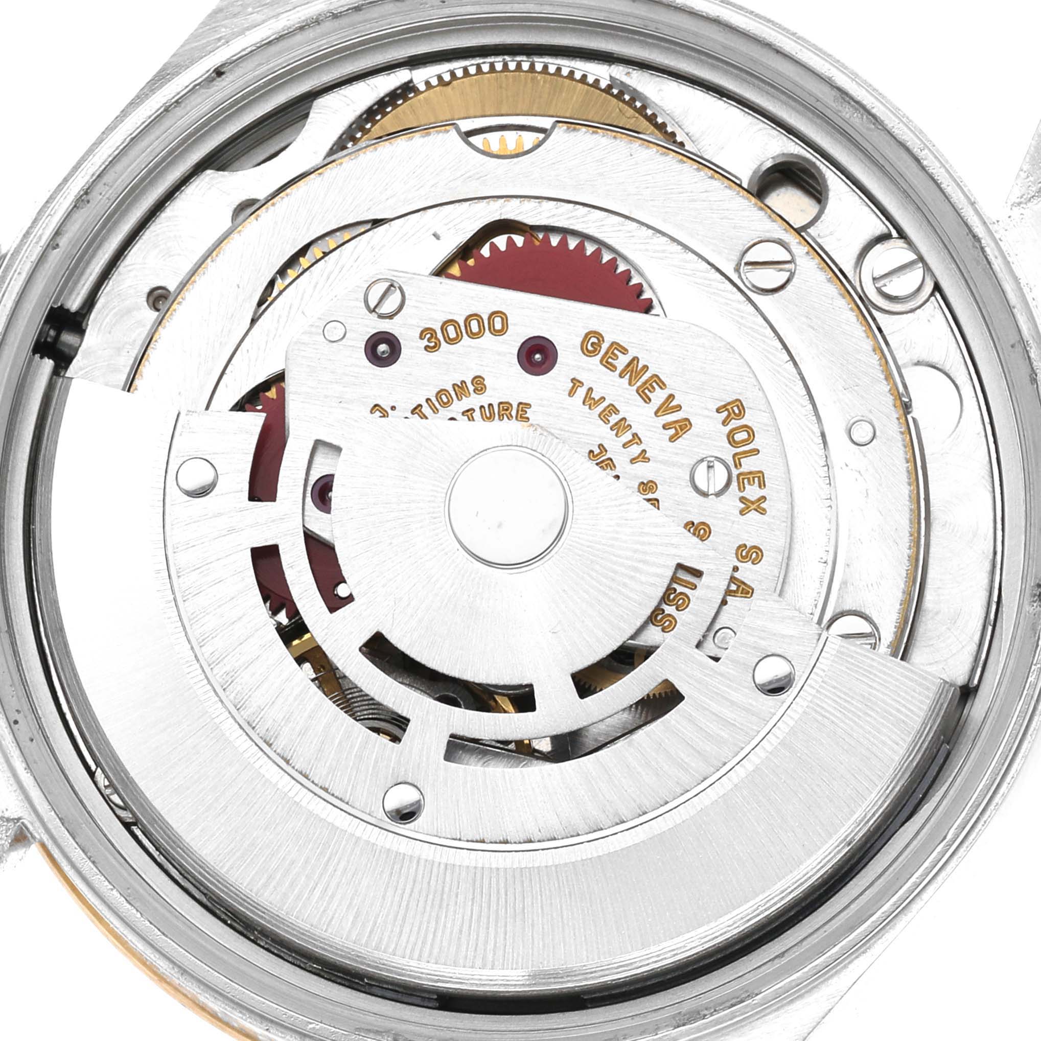 This is a close-up view of the movement mechanics inside a Rolex Oyster Perpetual 14233 Men's Steel and Gold (two tone) Grey Dial 14233 Men's Steel and Gold (two tone) Grey Dial watch.