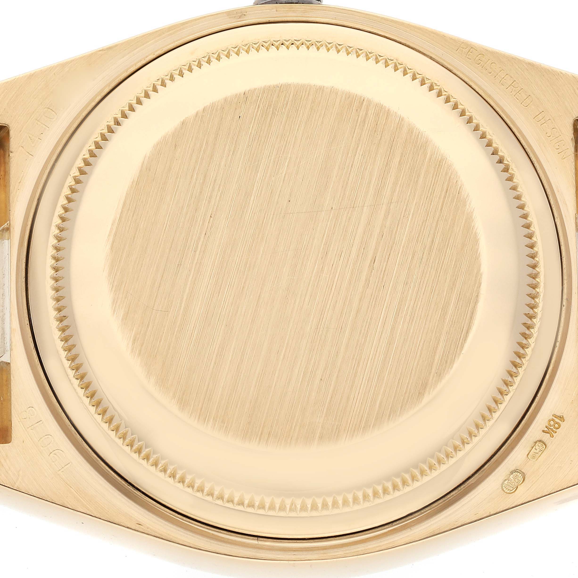 The image shows the case back of a Rolex Oysterquartz 19018 Men's Yellow Gold Black Dial 19018 Men's Yellow Gold Black Dial watch, highlighting its brushed finish and screw-down design.