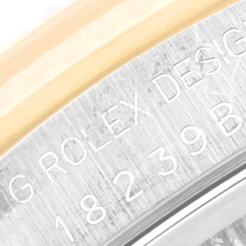 This close-up image of the Rolex President 18239 Men's White Gold Champagne Dial 18239 Men's White Gold Champagne Dial model shows the engraved text on the case side, including the model number.