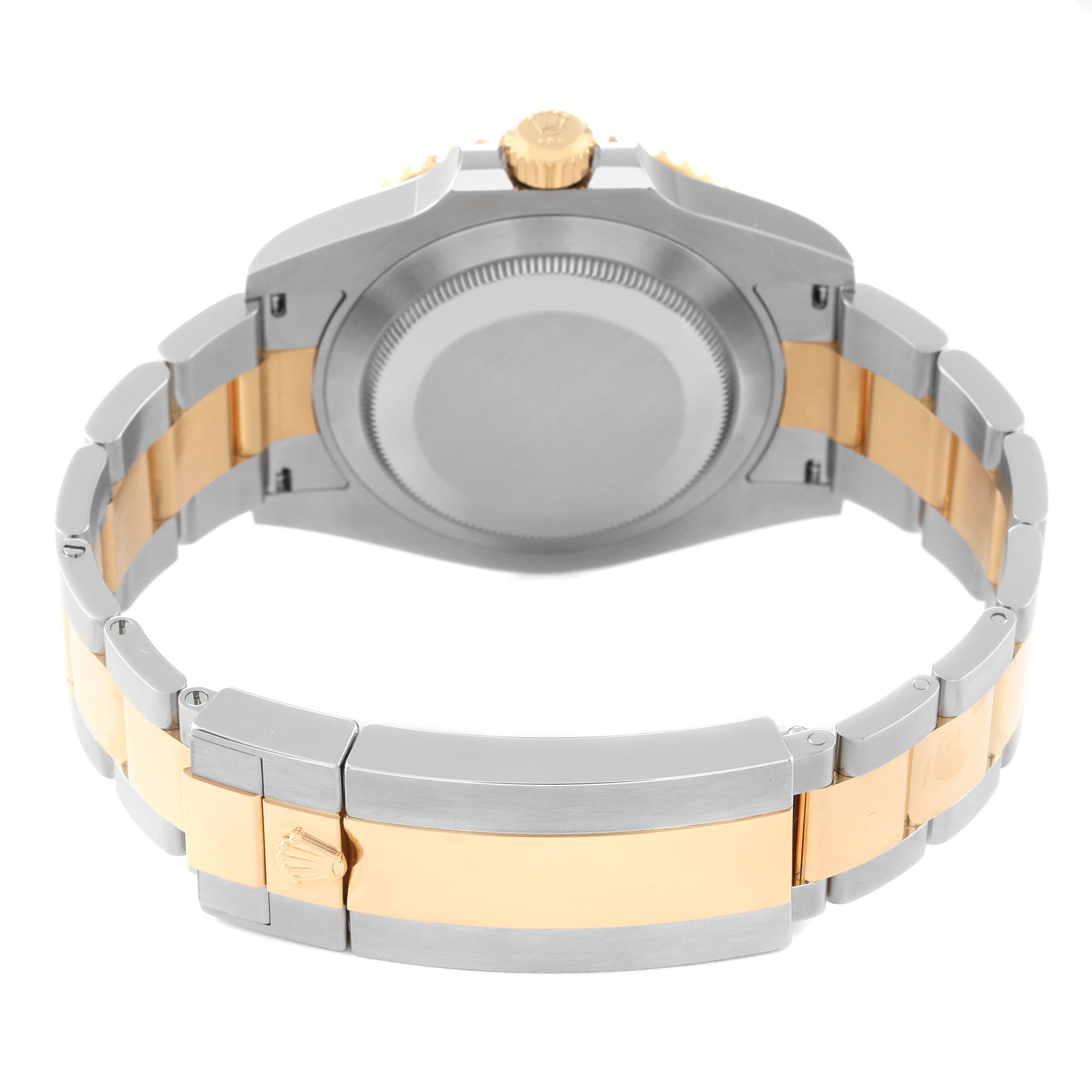 This image shows the back case and bracelet of a Rolex Submariner 126613LB Men's Steel and Gold (two tone) Blue Dial 126613LB Men's Steel and Gold (two tone) Blue Dial watch, highlighting its two-tone design.