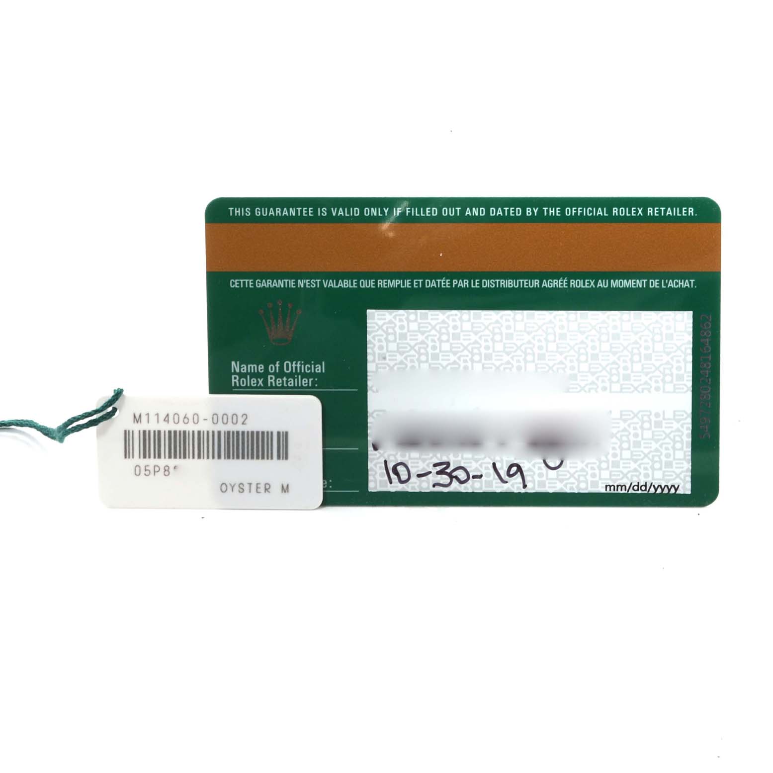 The image shows a Rolex Submariner 114060 Men
s Stainless Steel Black Dial 114060 Men
s Stainless Steel Black Dial warranty card and a white hang tag with a barcode and reference number.