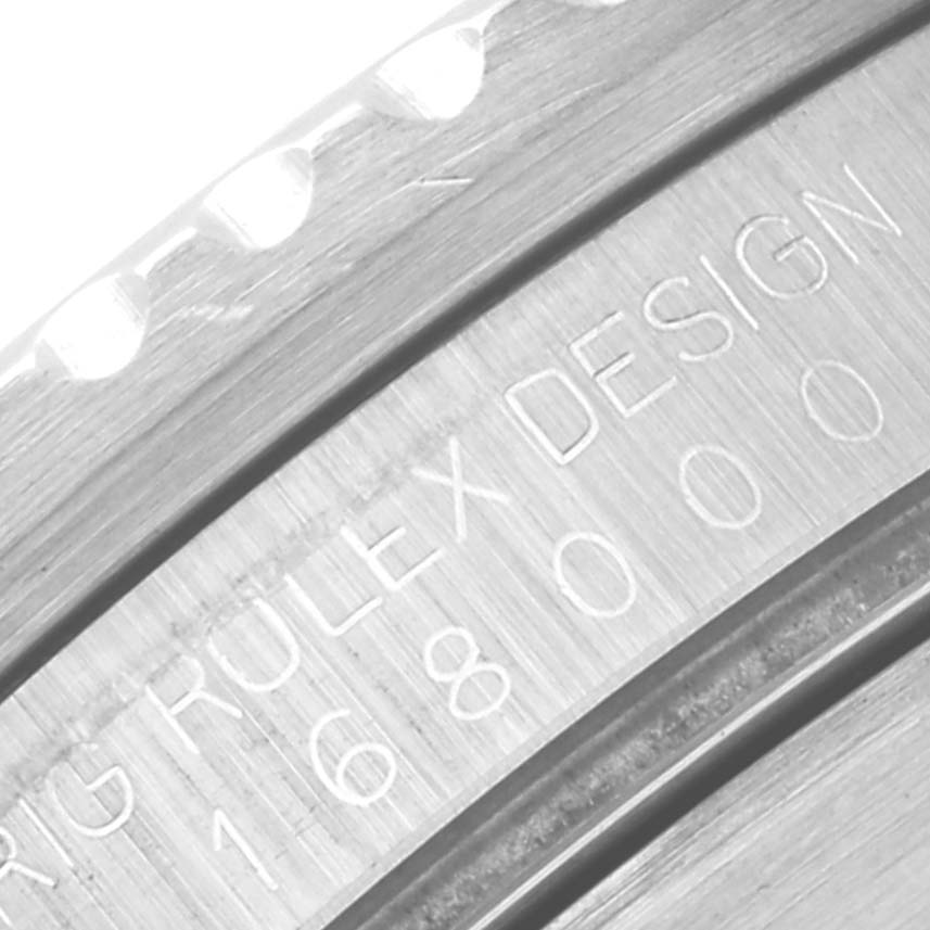 This image shows a close-up view of the engraved bezel edge on a Vintage Collection model by Rolex.