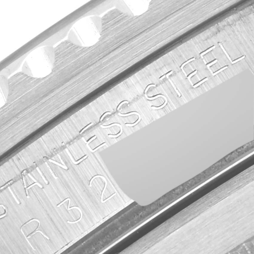 This image shows a macro view of the stainless steel bezel and engraved details of a Rolex Vintage Collection 168000 Men's Stainless Steel Black Dial 168000 Men's Stainless Steel Black Dial watch.