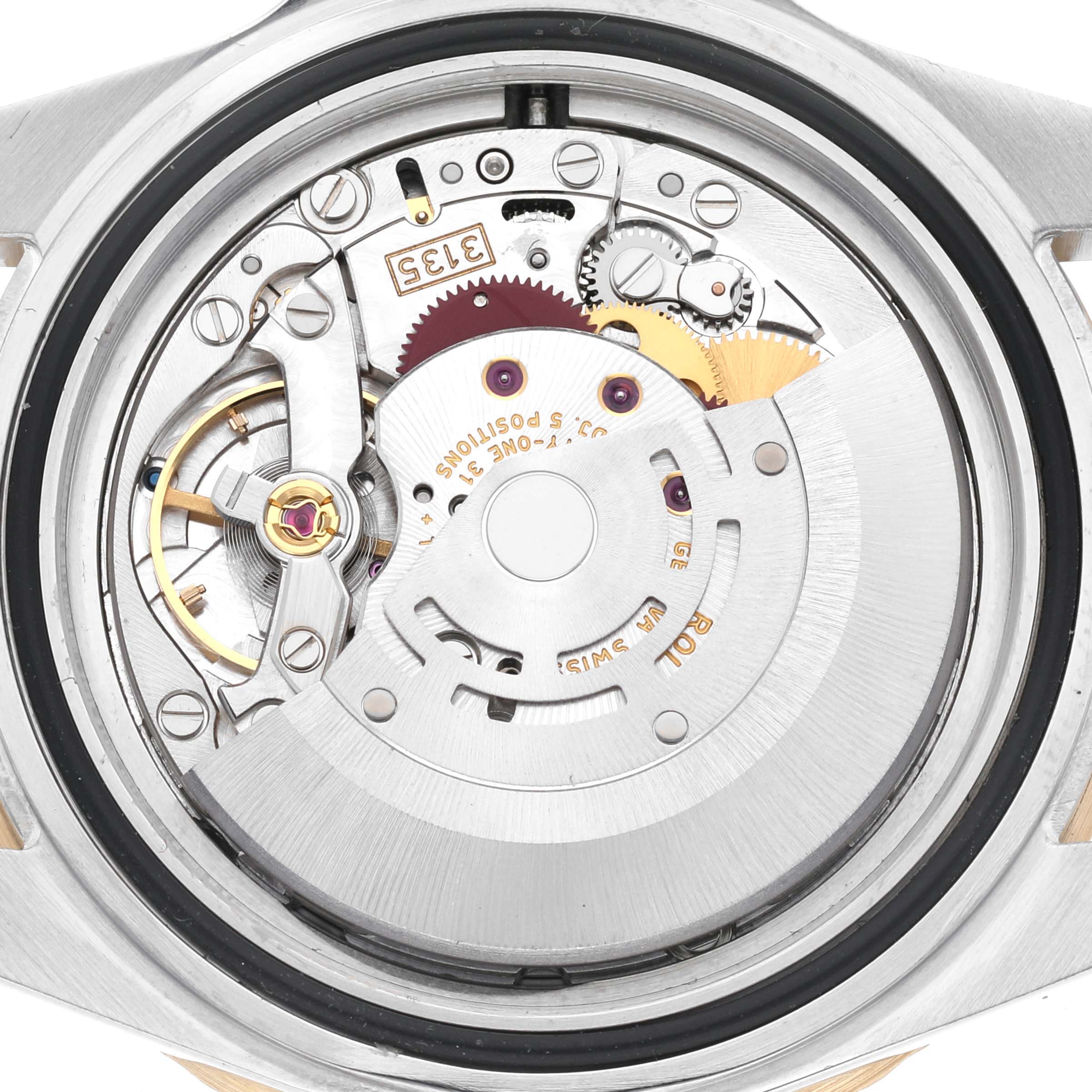 This image shows the open case back of a Rolex Submariner 16613 Men
s Steel and Gold (two tone) Grey Dial 16613 Men
s Steel and Gold (two tone) Grey Dial, revealing its intricate internal movement.