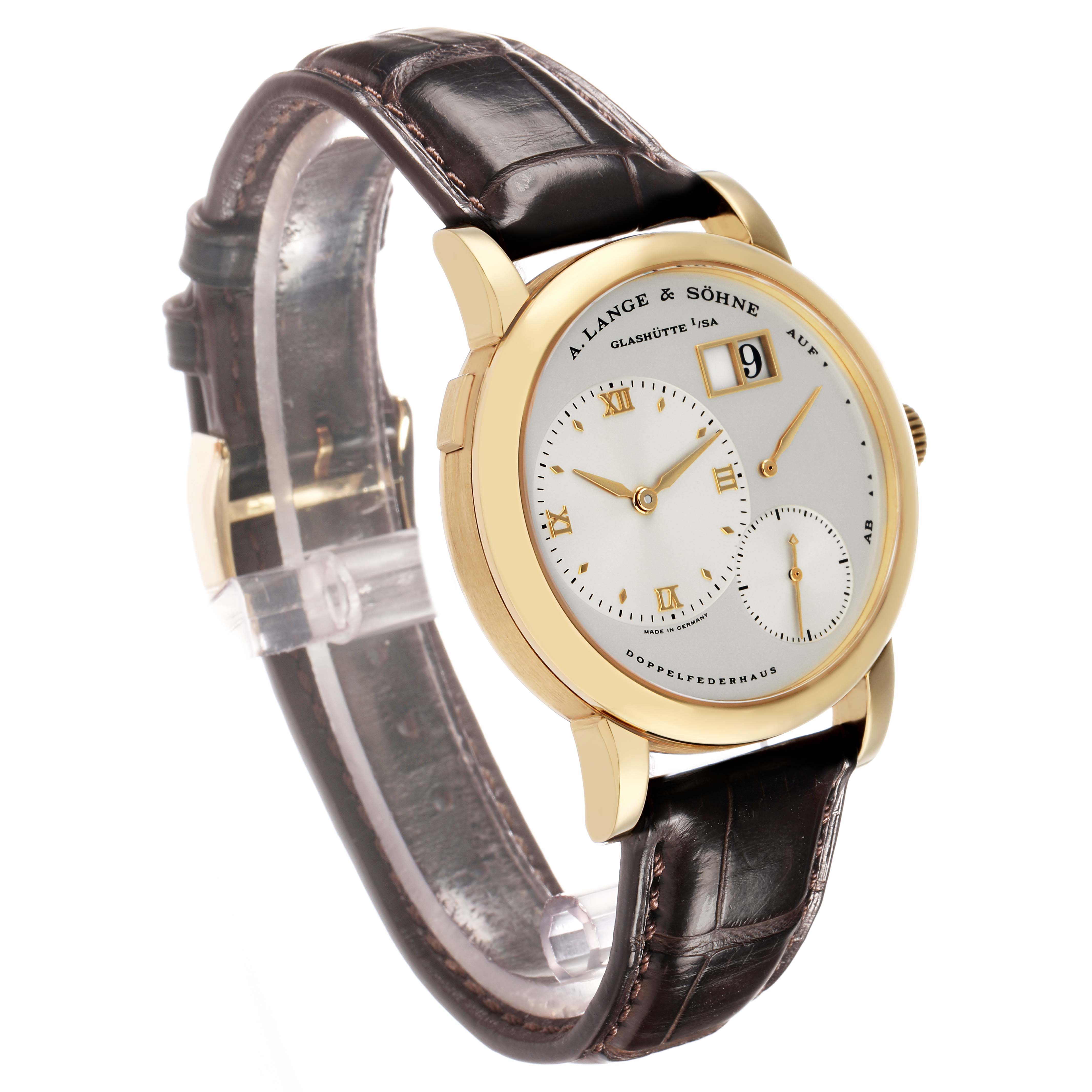 The A. Lange & Sohne Lange 1 101.021 Men's Yellow Gold Silver Dial watch is shown at a three-quarter angle, highlighting the dial, gold case, and leather strap.