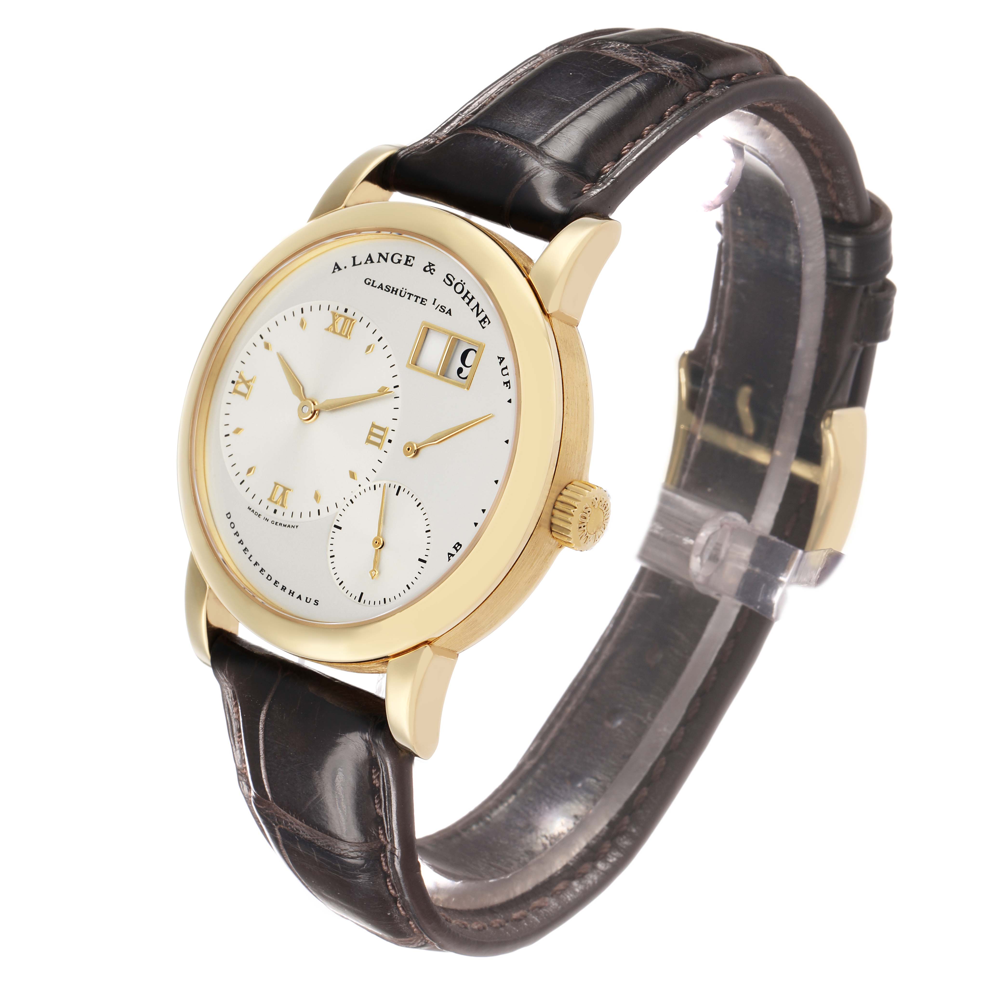 The A. Lange & Sohne Lange 1 101.021 Men's Yellow Gold Silver Dial watch is shown at a three-quarter angle, displaying the face, case, and leather strap.
