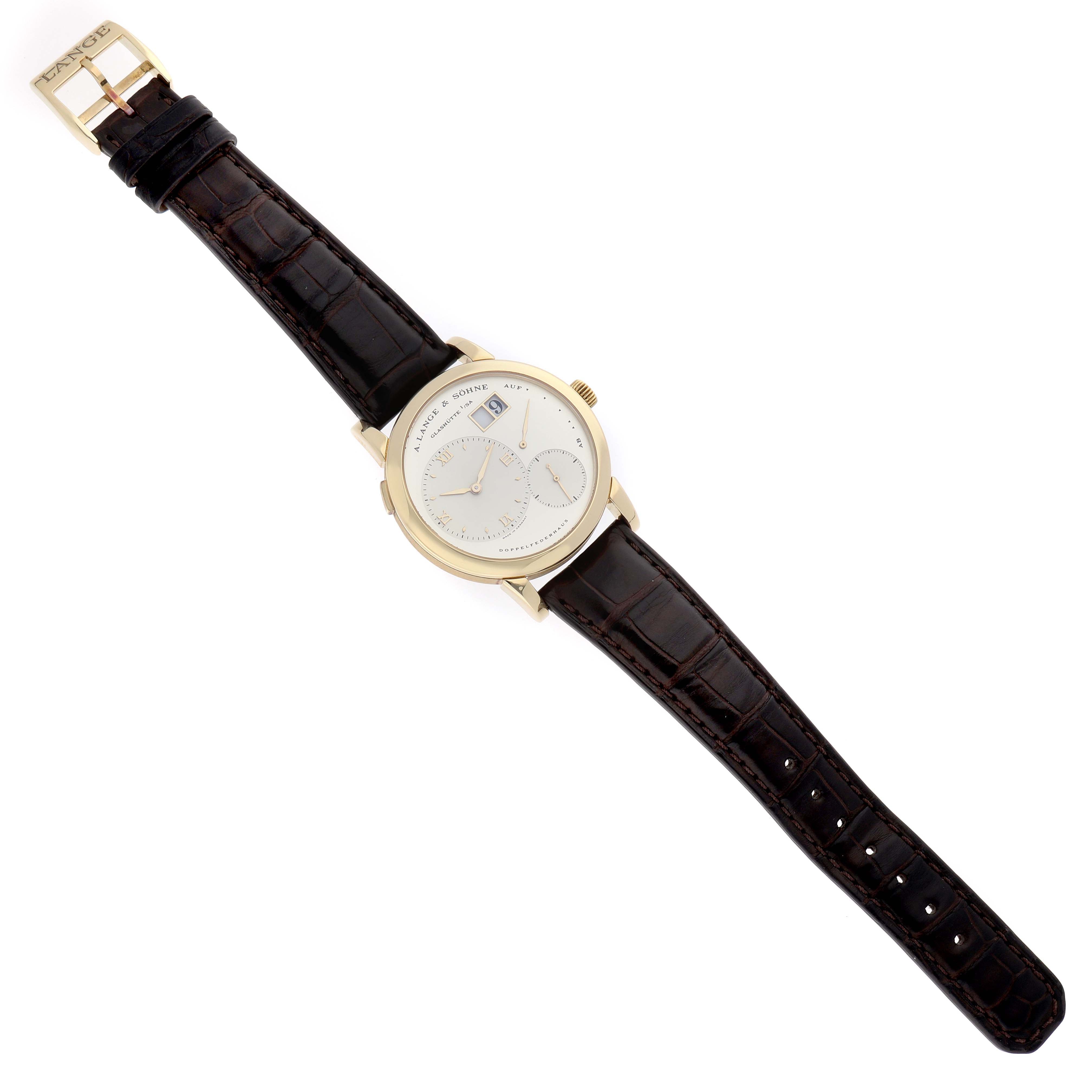 The Lange 1 by A. Lange & Söhne is shown from above, displaying the dial, leather strap, and buckle.