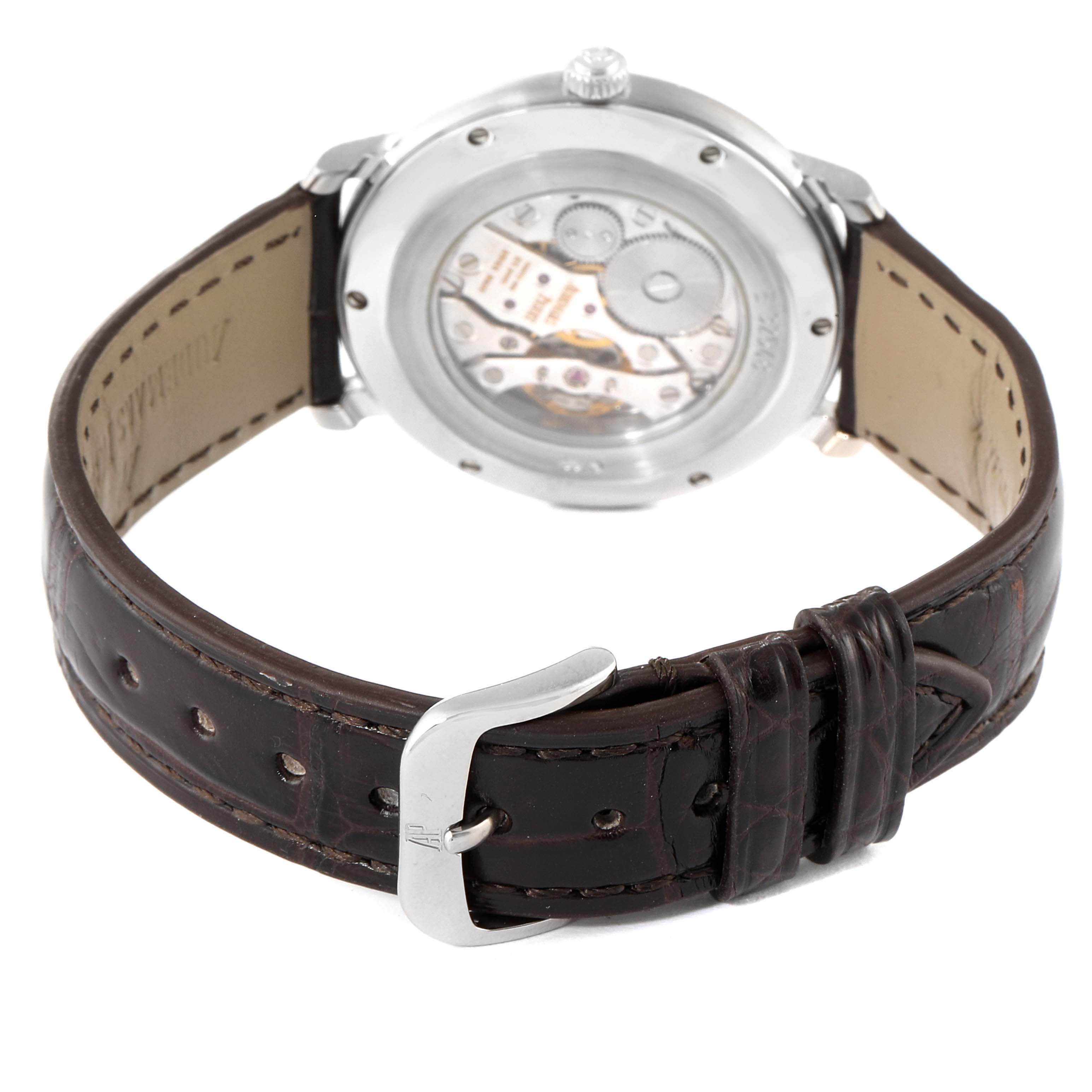 The image shows the back view of an Audemars Piguet Jules 15056BC.OO.0001CR.01 Men's White Gold Silver Dial 15056BC.OO.0001CR.01 Men's White Gold Silver Dial model watch, highlighting the movement through a transparent case back and the leather strap.