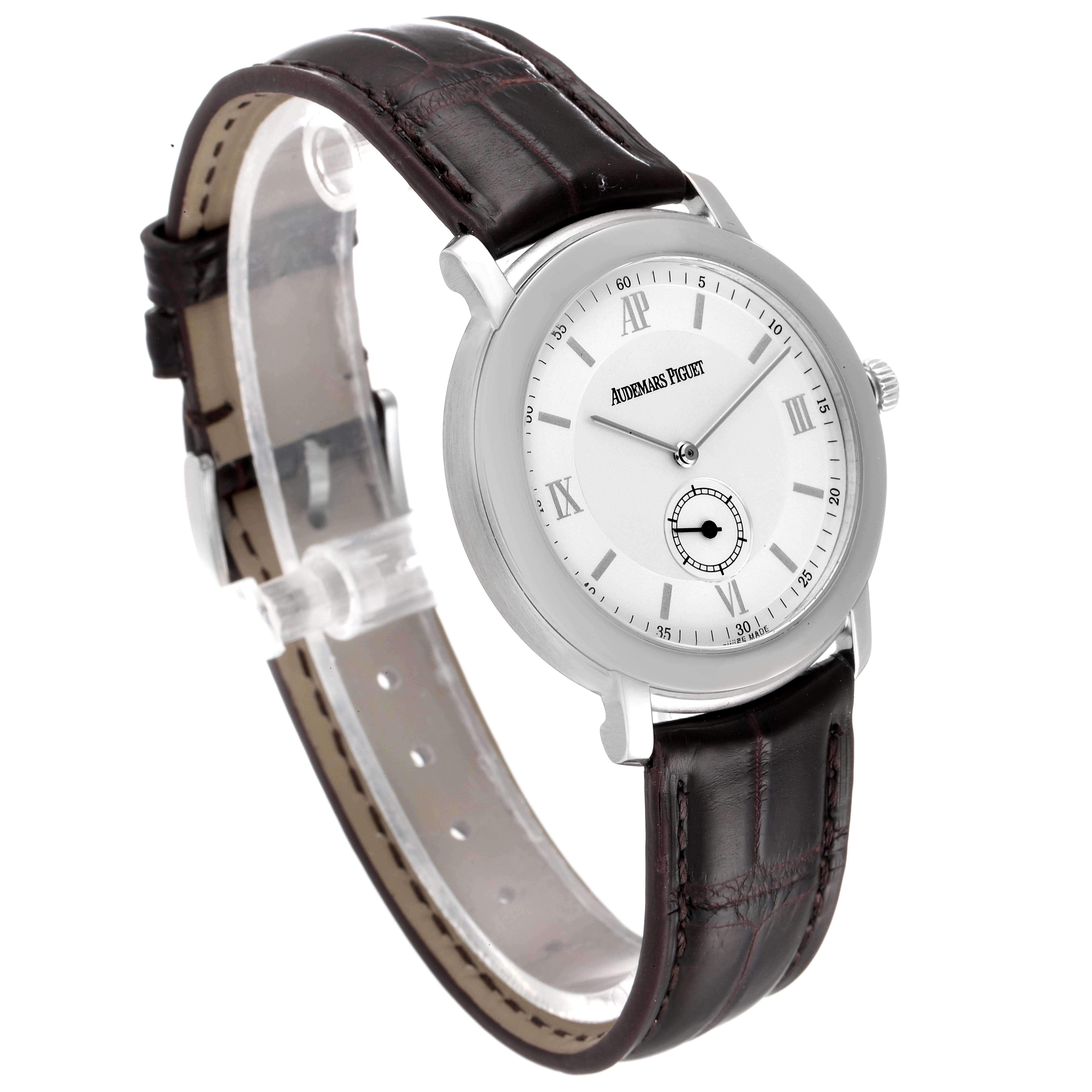 The watch, an Audemars Piguet Jules 15056BC.OO.0001CR.01 Men's White Gold Silver Dial 15056BC.OO.0001CR.01 Men's White Gold Silver Dial model, is shown at a three-quarter angle, revealing the face, crown, and leather strap.