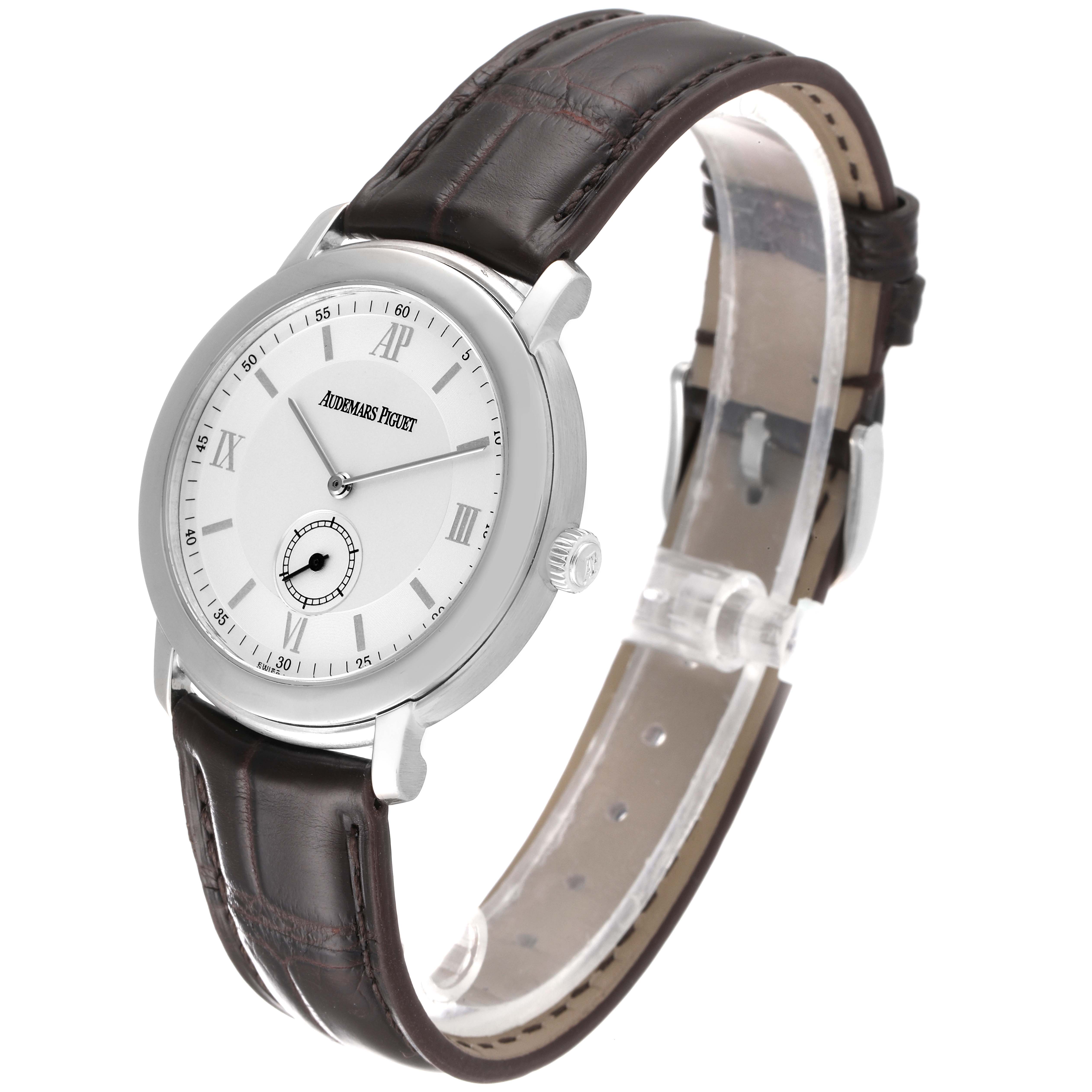 The image shows a side angle view of the Audemars Piguet Jules 15056BC.OO.0001CR.01 Men's White Gold Silver Dial 15056BC.OO.0001CR.01 Men's White Gold Silver Dial watch, displaying its face, bezel, crown, and leather strap.