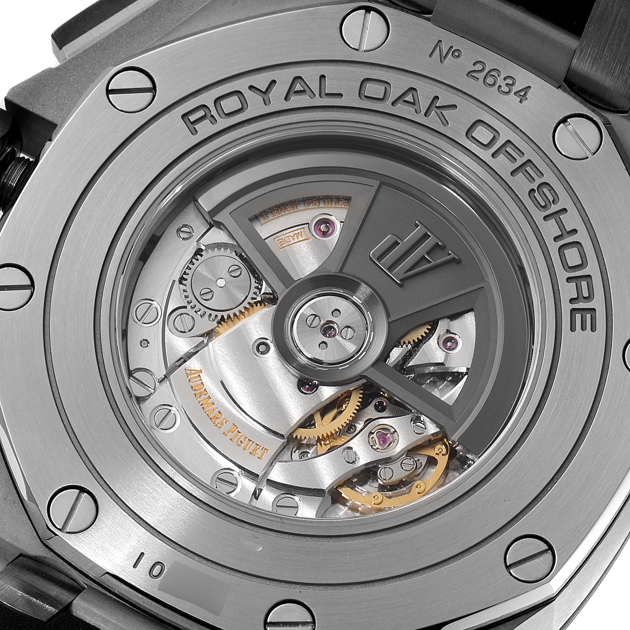 The image shows the back view of the Audemars Piguet Royal Oak Offshore 26400SO.OO.A002CA.01 Men's Stainless Steel Silver Dial 26400SO.OO.A002CA.01 Men's Stainless Steel Silver Dial watch, highlighting its intricate movement and rotor.