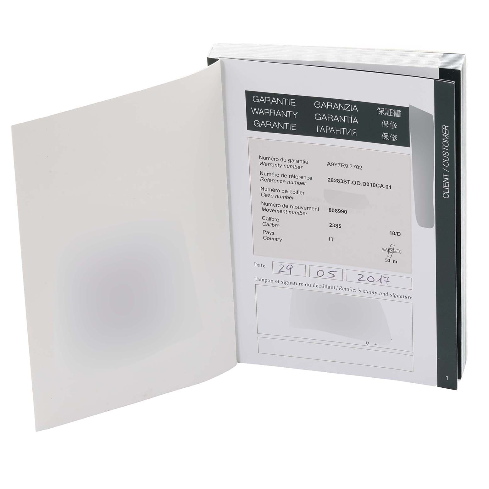 The image shows an open warranty booklet for the Audemars Piguet Royal Oak Offshore 26283ST.OO.D010CA.01 Men's Stainless Steel Silver Dial 26283ST.OO.D010CA.01 Men's Stainless Steel Silver Dial model, displaying the warranty and reference numbers.