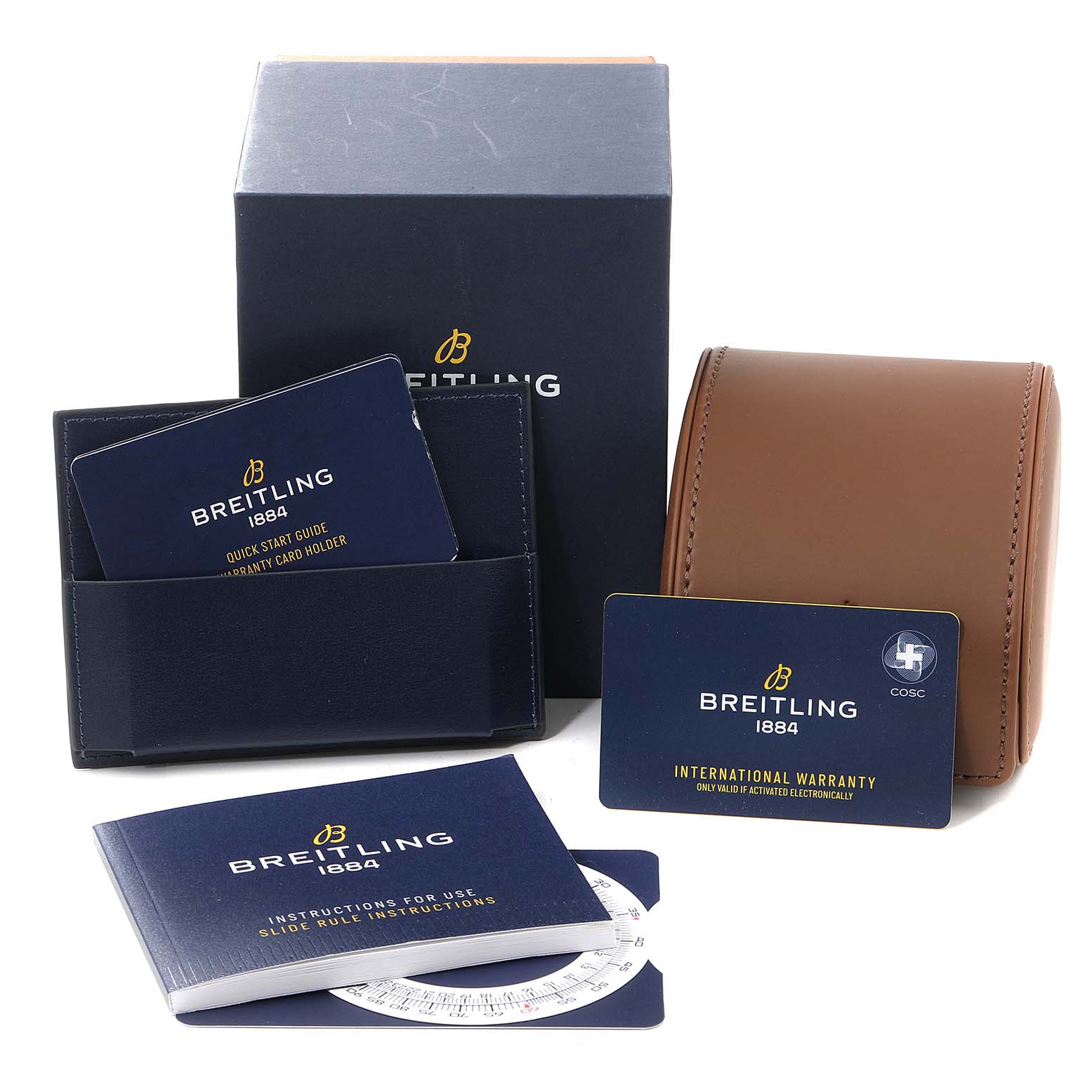Accessories for the Breitling Navitimer UB0121 Men's Steel and Gold (two tone) Grey Dial UB0121 Men's Steel and Gold (two tone) Grey Dial, including a box, leather travel case, instruction manuals, and warranty cards, are shown.