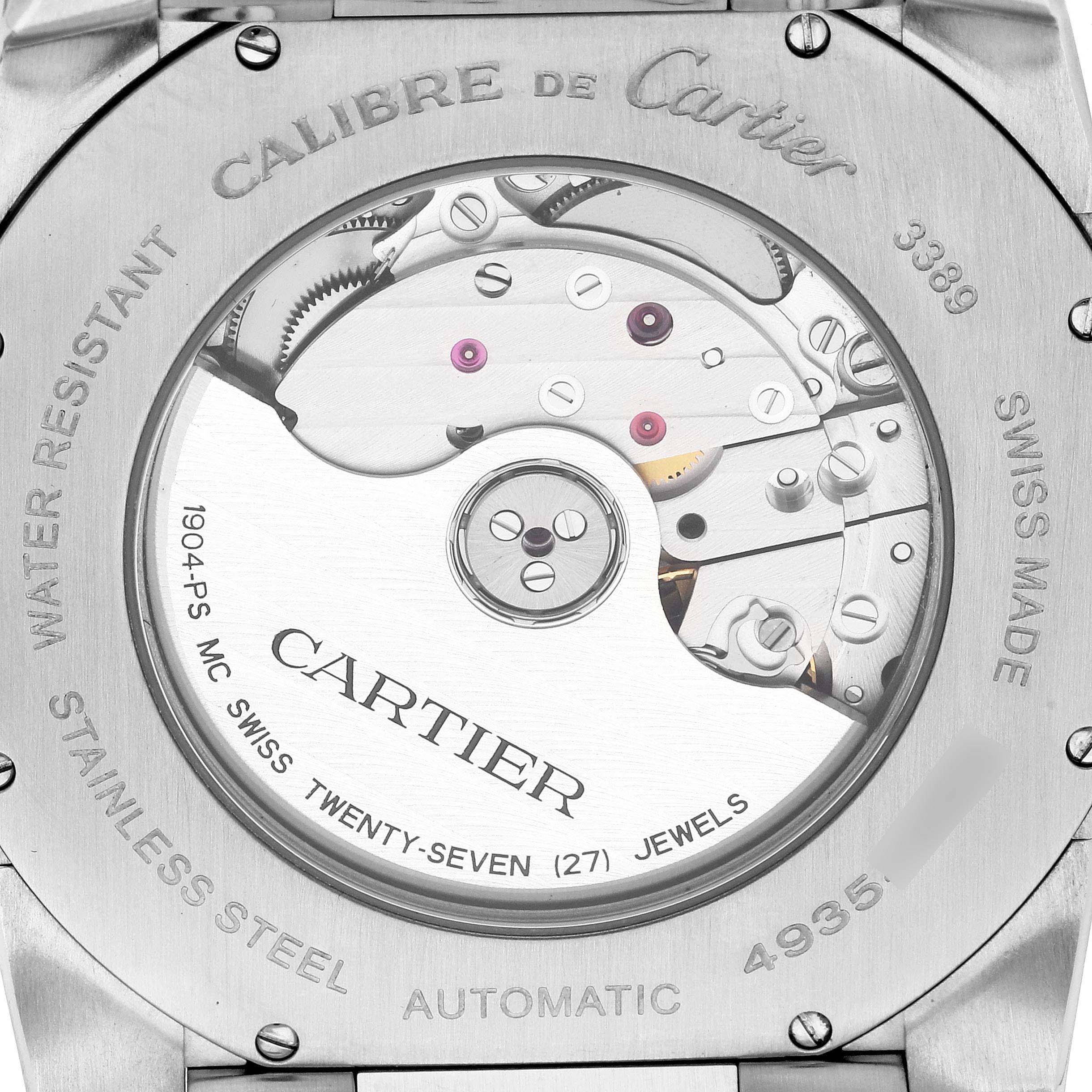 This image shows the back view of the Calibre de Cartier model by Cartier, highlighting the movement mechanism and engravings.