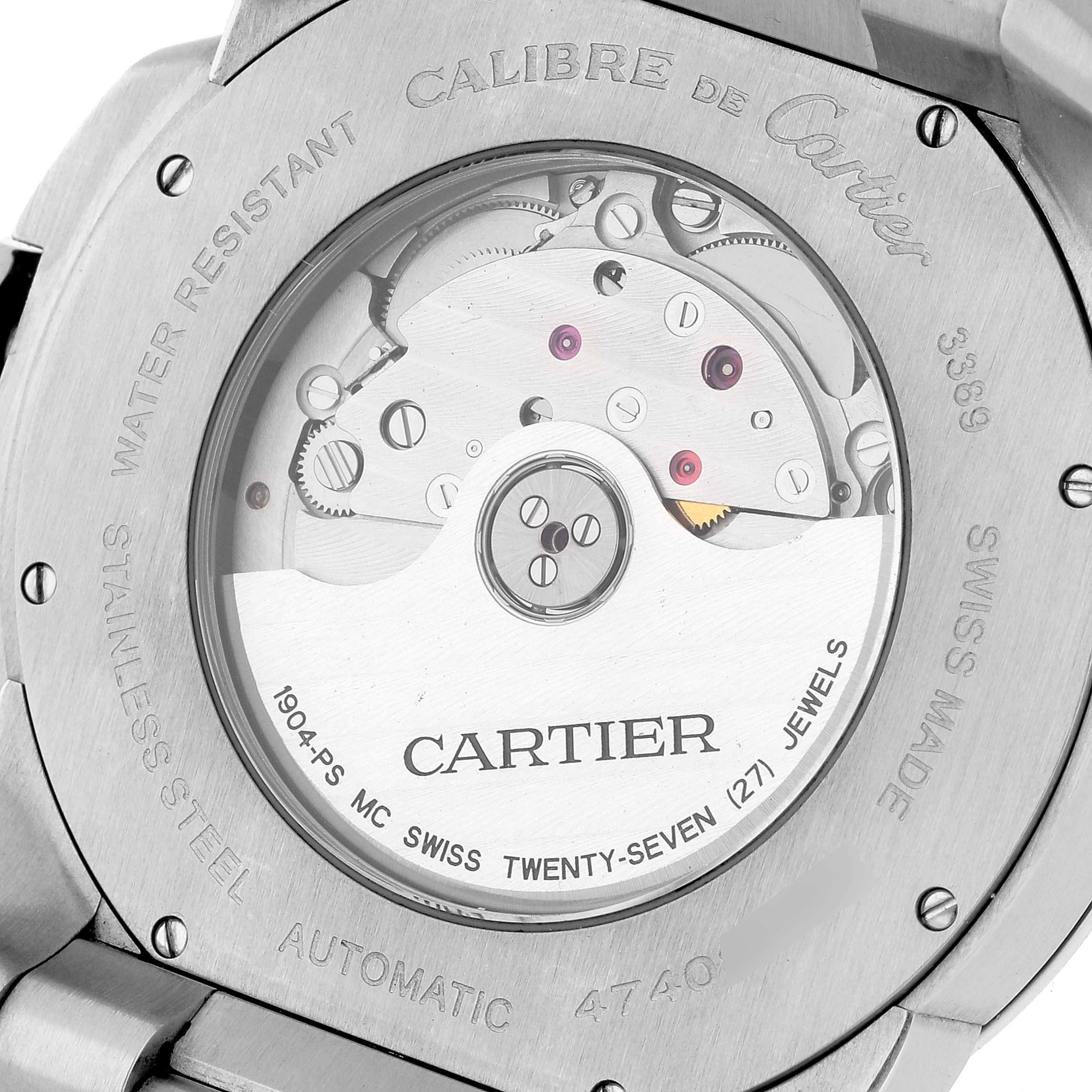The image shows the back of a Calibre de Cartier watch by Cartier, displaying its automatic movement and inscriptions.