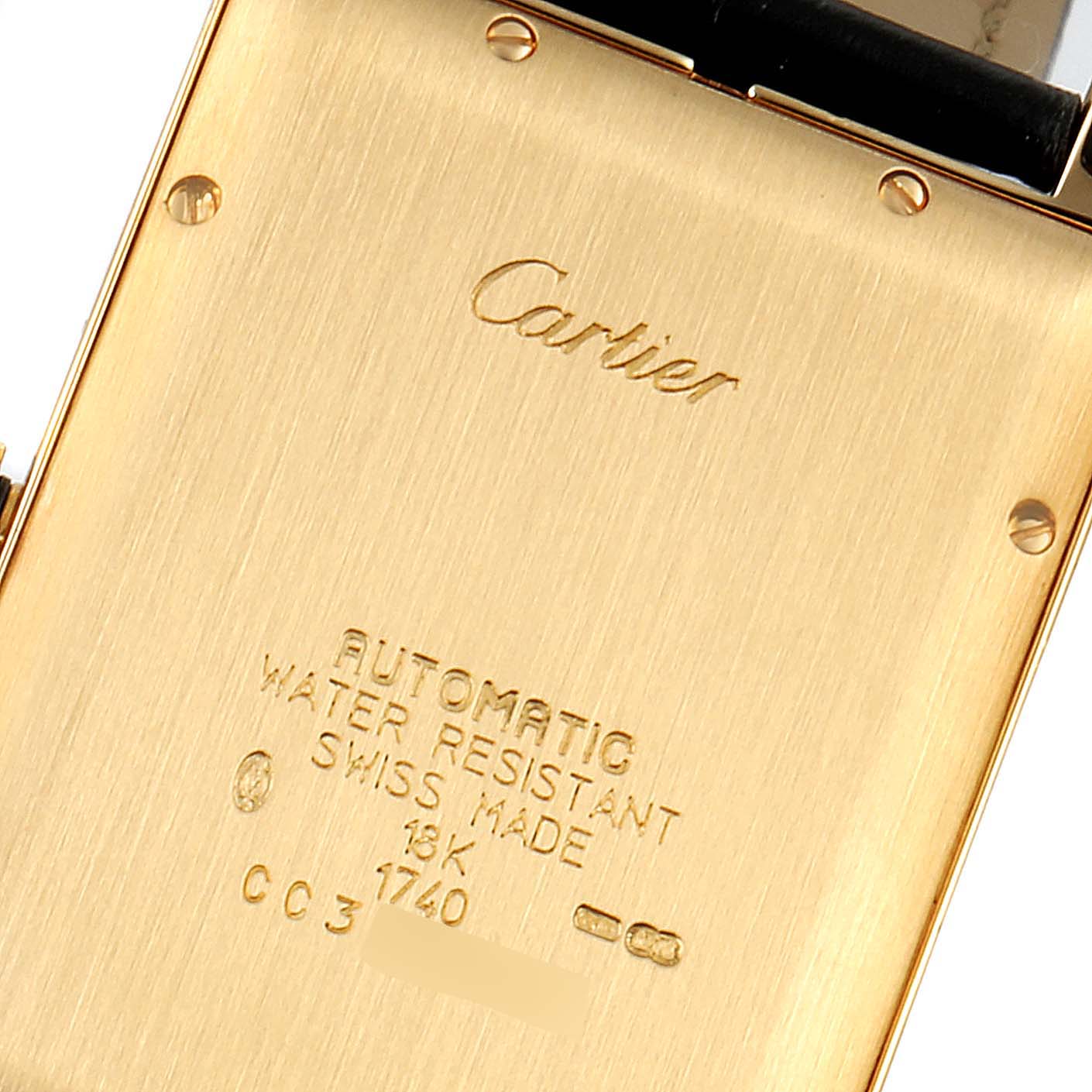 This image shows the back case of the Cartier Tank Americaine WB702051 Men's Yellow Gold Silver Dial WB702051 Men's Yellow Gold Silver Dial watch, highlighting its engravings and details.
