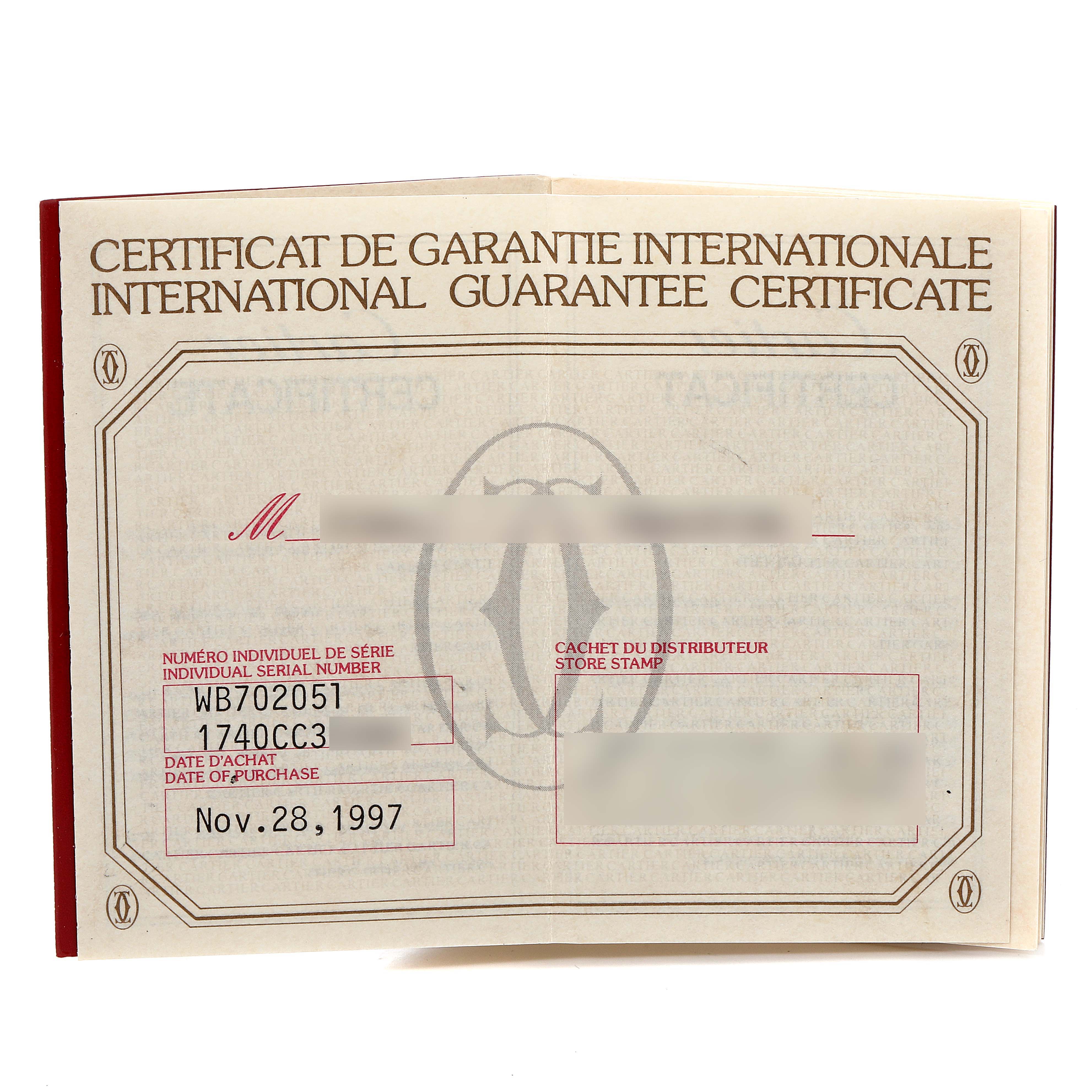 This is an international guarantee certificate for a Cartier Tank Americaine WB702051 Men's Yellow Gold Silver Dial WB702051 Men's Yellow Gold Silver Dial watch, including details like serial number and purchase date.