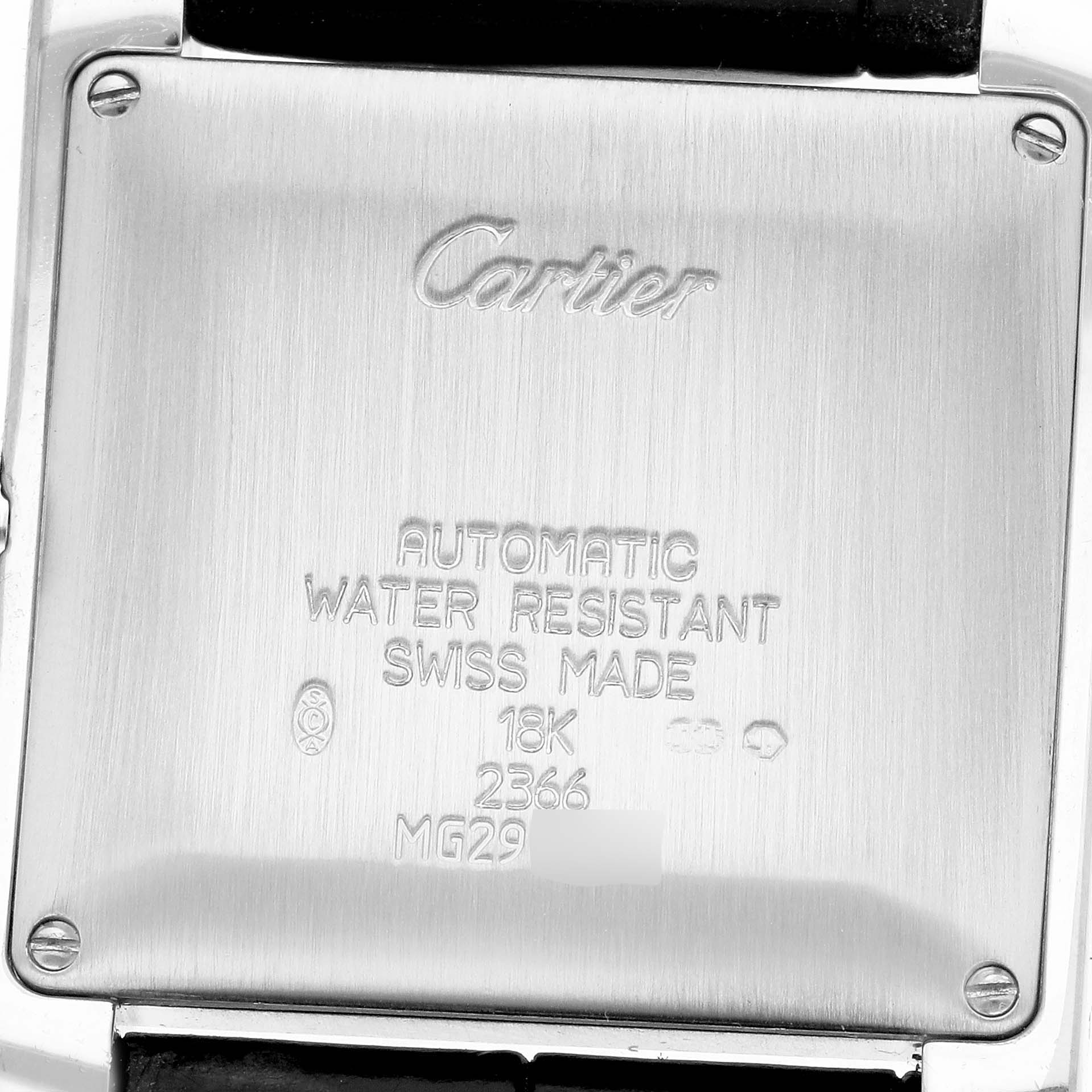 The image shows the back of a Cartier Tank Française watch, detailing its engravings and screws.